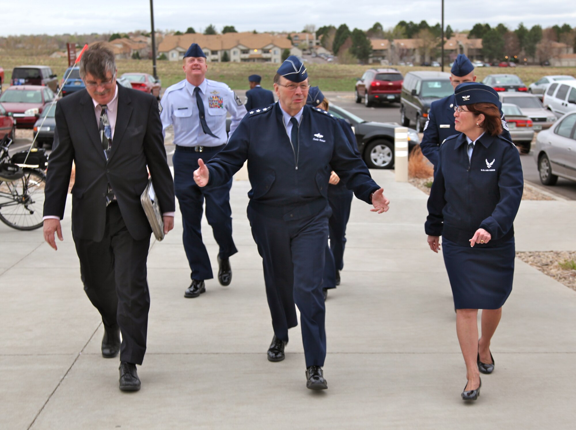 Mr. Stephen Hannan, Air Reserve Personnel Center director of staff, Lt. Gen. Charles E. Stenner Jr., Chief of Air Force Reserve and the Air Force Reserve Command commander, and Col. Pat Blassie, ARPC commander, enter the ARPC headquarters building April 2, 2012, on Buckley Air Force Base, Colo. (U.S. Air Force photo/Quinn Jacobson)