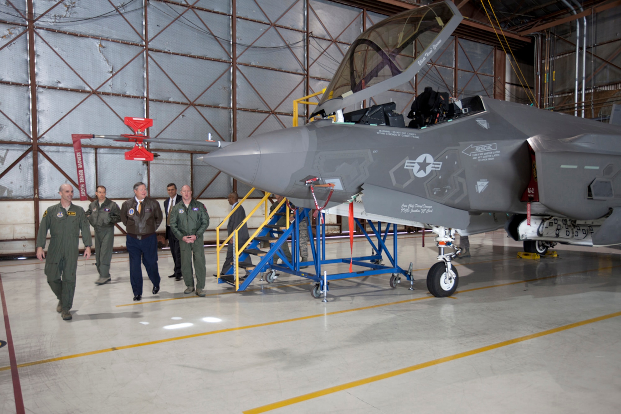 Lt. Col. George Schwartz, Commander of the 461st Flight Test Squadron at Edwards AFB, gives a tour of AF-2 to the Honorable Secretary of the Air Force Michael B. Donley (brown coat).  (photo by Paul Weatherman, Lockheed Martin)