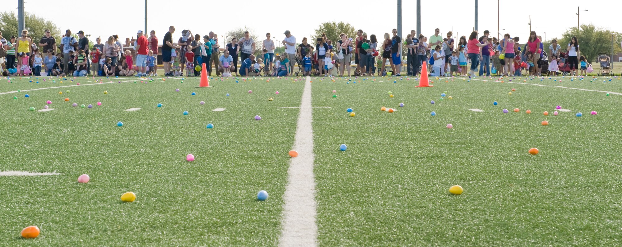 Dyess members and children line up March 31, 2012 during an Easter egg hunt, at Dyess Air Force Base, Texas. The youth center supported the annual event by collecting 3,000 eggs and laying them out for the participants. (U.S. Air Force photo by Airman 1st Class Jonathan Stefanko/ Released)
