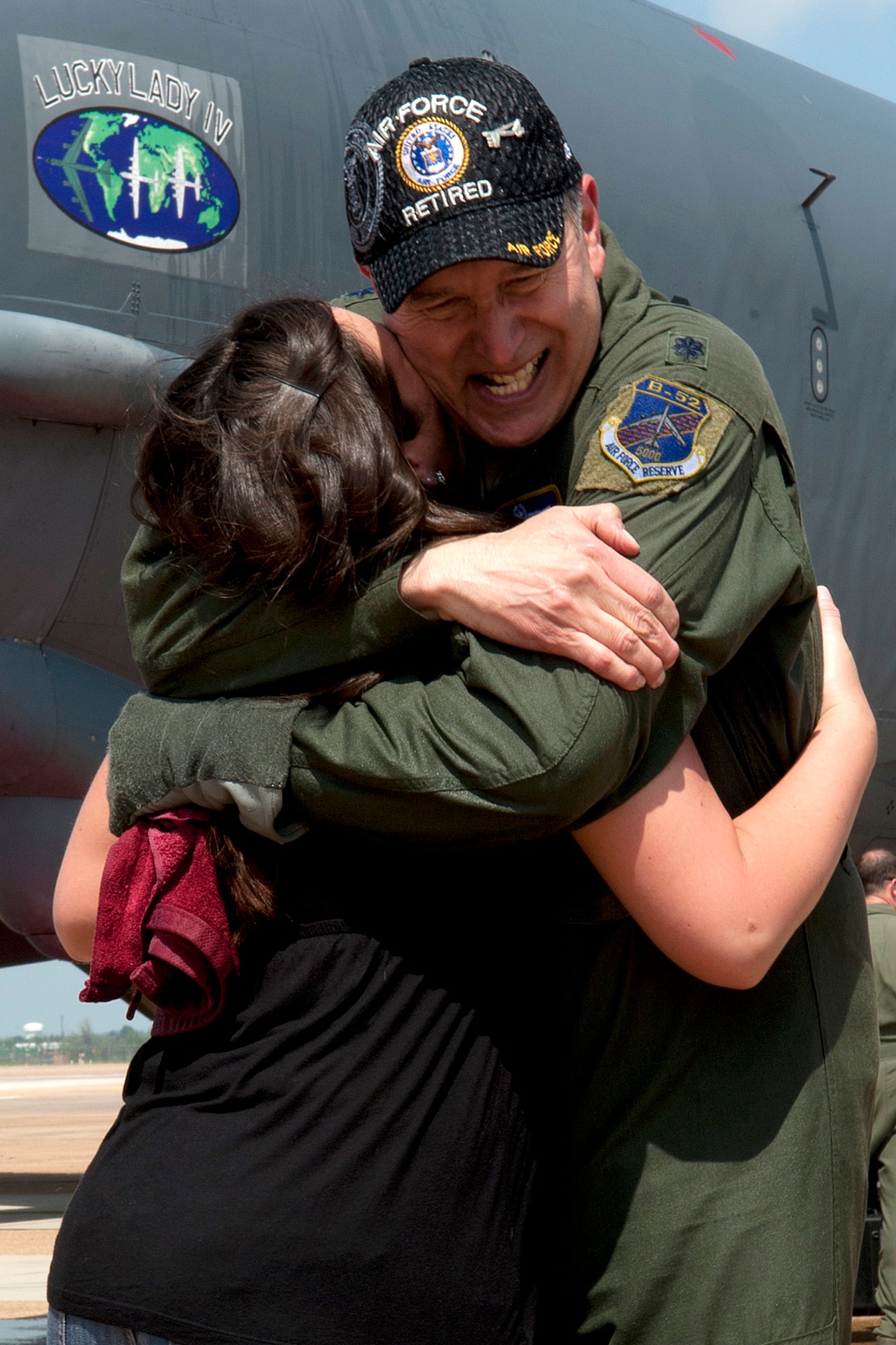 U.S. Air Force Lt. Col. Rafael Rodriguez, 343rd Bomb Squadron navigator, gets a hug from his daughter Beverly after his return from a sortie at Barksdale Air Force Base, La., March 31, 2012. This sortie marked the last flight in a B-52 Stratofortress for Rodriguez, who is retiring from the Air Force Reserve. (U.S. Air Force photo by Master Sgt. Greg Steele/Released)