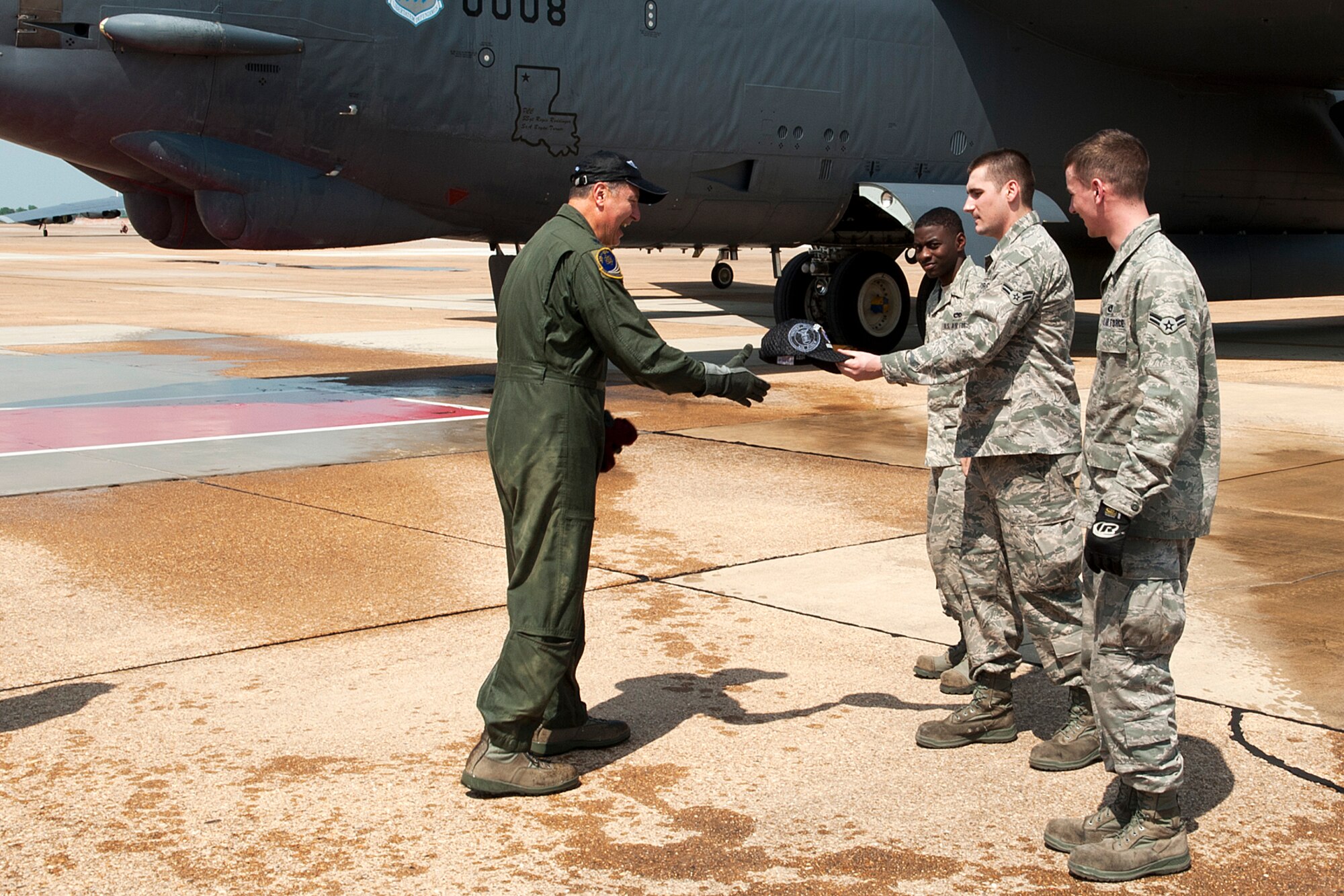 U.S. Air Force Lt. Col. Rafael Rodriguez, 343rd Bomb Squadron navigator, is presented a retirement cap from the aircraft crew chiefs after returning from his last sortie in a B-52 Stratofortress at Barksdale Air Force Base, La., March 31, 2012. Rodriguez has logged a total of over 5,400 flying hours and has flown 49 combat sorties and over 600 flying hours in support of Operation Desert Storm, Operation Enduring Freedom and Operation Iraqi Freedom. (U.S. Air Force photo by Master Sgt. Greg Steele/Released)
