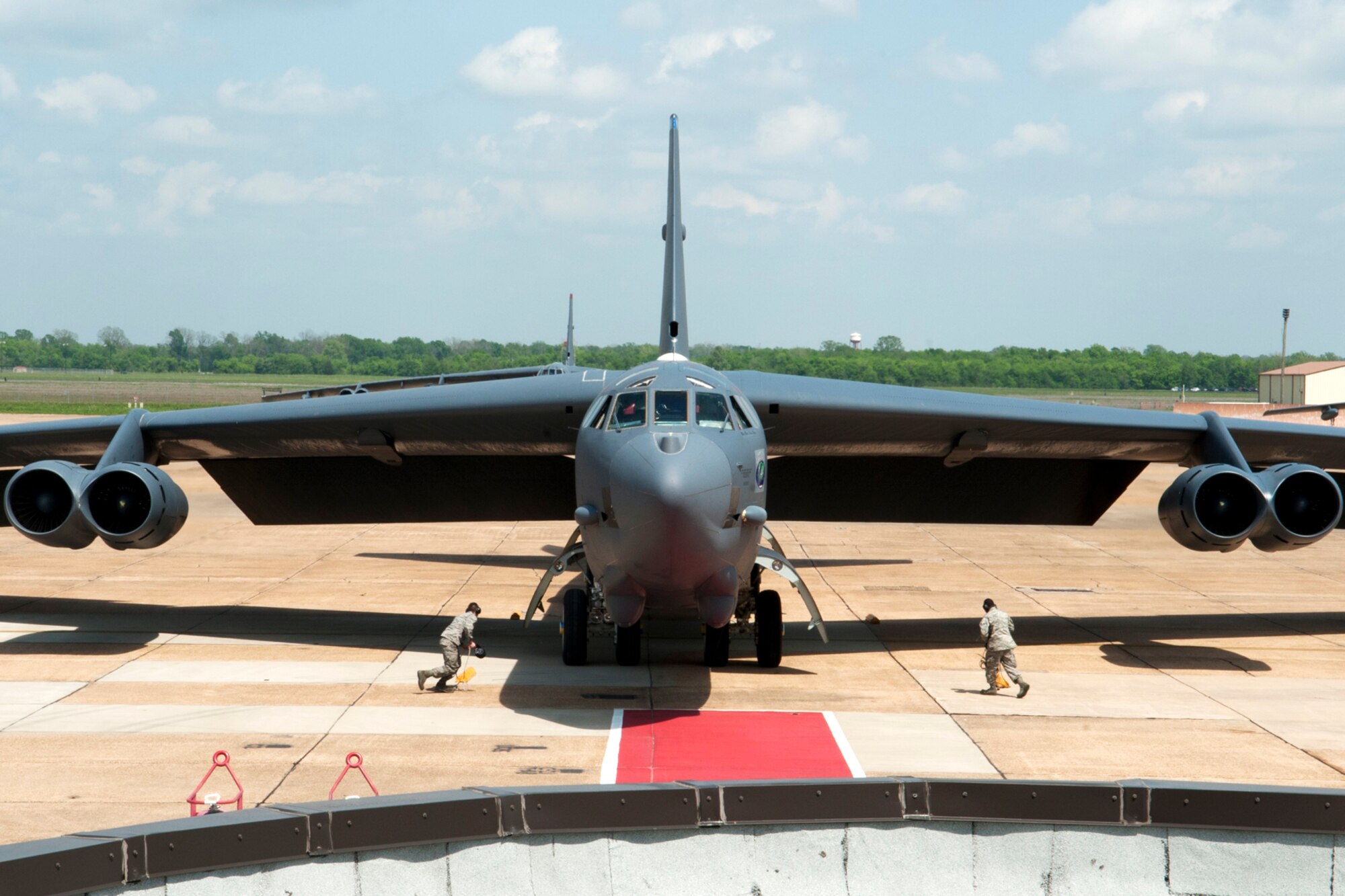 A 2nd Bomb Wing B-52 Stratofortress gets the red carpet treatment after returning from a sortie at Barksdale Air Force Base, La., March 31, 2012. This sortie is special because it marked the last flight for the navigator on the aircraft, U.S. Air Force Lt. Col. Rafael Rodriguez, who assigned to the 343rd Bomb Squadron and is retiring from the Air Force Reserve with over 5,400 flying hours in the B-52. (U.S. Air Force photo by Master Sgt. Greg Steele/Released)