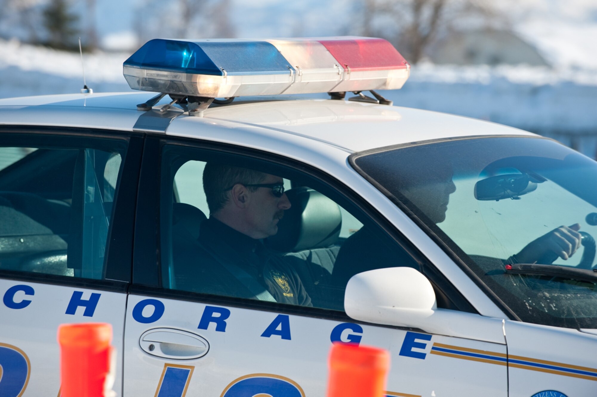 JOINT BASE ELMENDORF-RICHARDSON, Alaska ??? Anchorage Police Department Supervisor, Sergeant Rod Ryan, observes, evaluates, and assists one of the Police Academy recruits March 22, during their Emergency Vehicle Operations Course which has been held on base for the past 20 years. (U.S. Air Force photo/Johnathon Green)