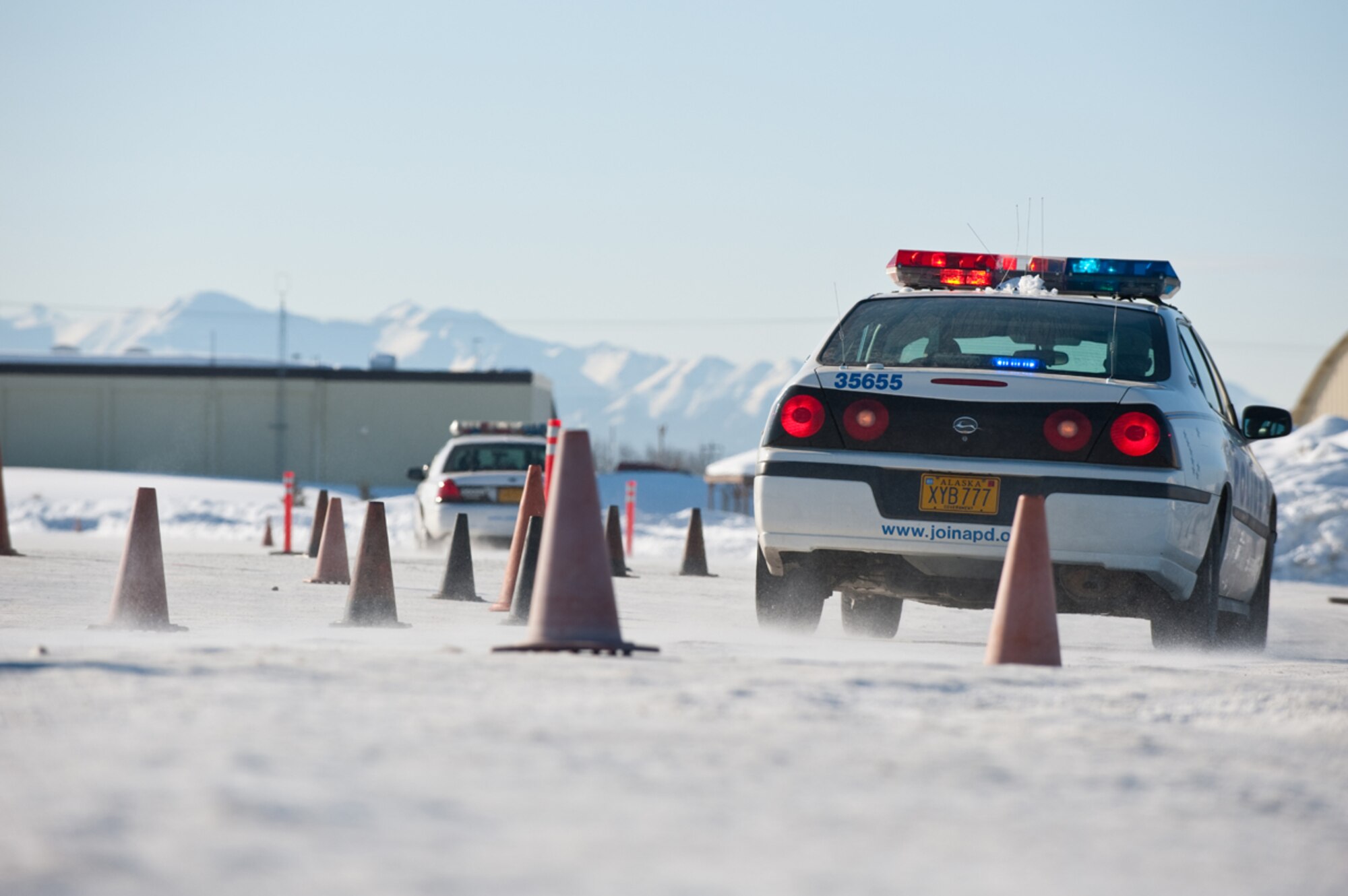 JOINT BASE ELMENDORF-RICHARDSON, Alaska - - New Police Academy recruits practice winter driving techniques, March 22. Joint Base Elmendorf-Richardson has hosted the Anchorage Police Department???s Emergency Vehicle Operations Course for the last 20 years. (U.S. Air Force photo/Johnathon Green)