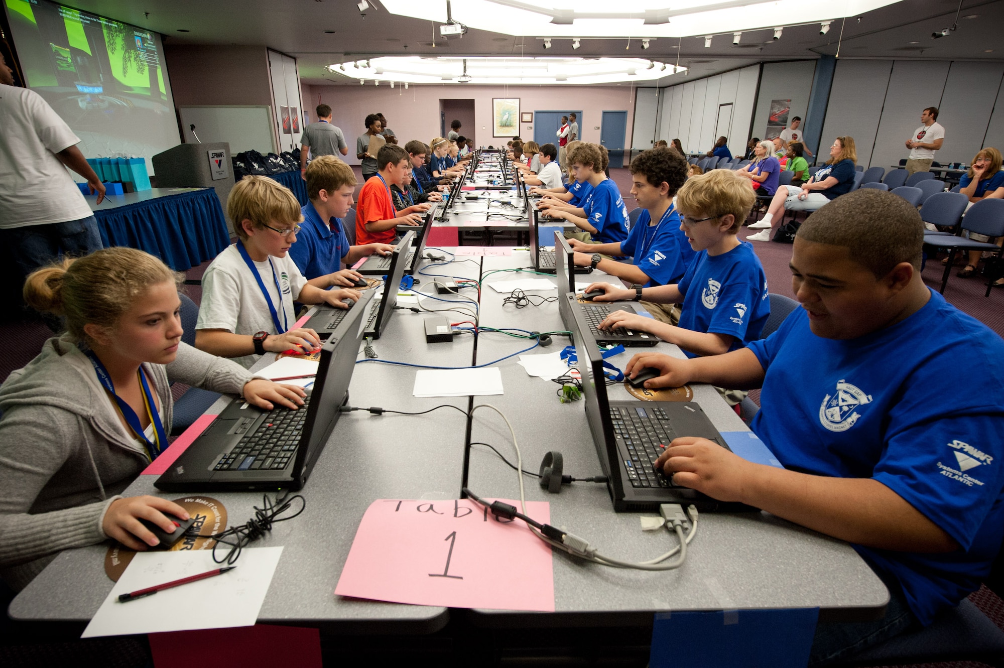 Six teams from Tri-County area middle schools participate in a DimensionU competition at SPAWAR Systems Center Atlantic Conference Center at Joint Base Charleston - Weapons Station March 29. DimensionU is part of SSC Atlantic's science, technology, engineering and math outreach program. (U.S. Navy photo/Joe Bullinger)