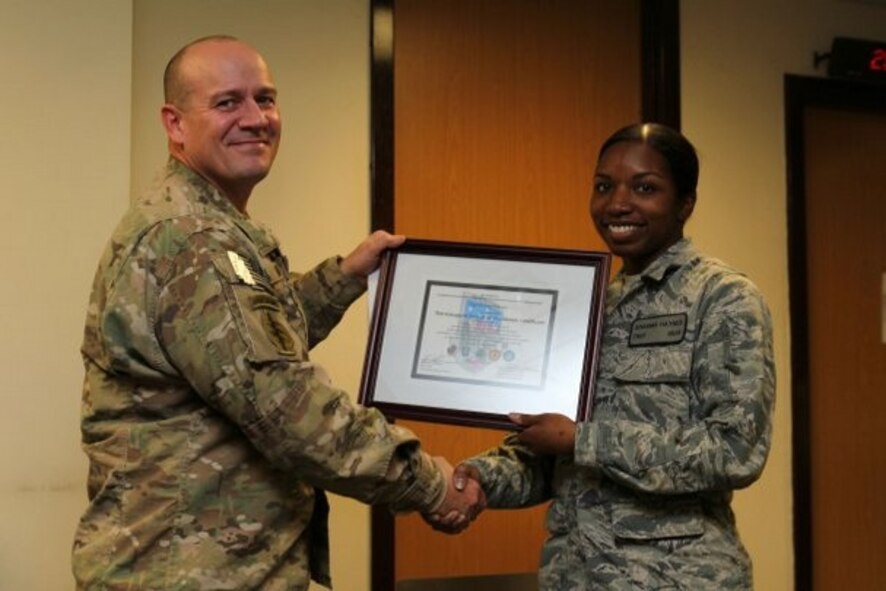 Tech. Sgt. Sharma Haynes, 7th Comptroller Squadron, was awarded the first Pitbull of the Month award as well as a Bronze Star for her tour of duty.
