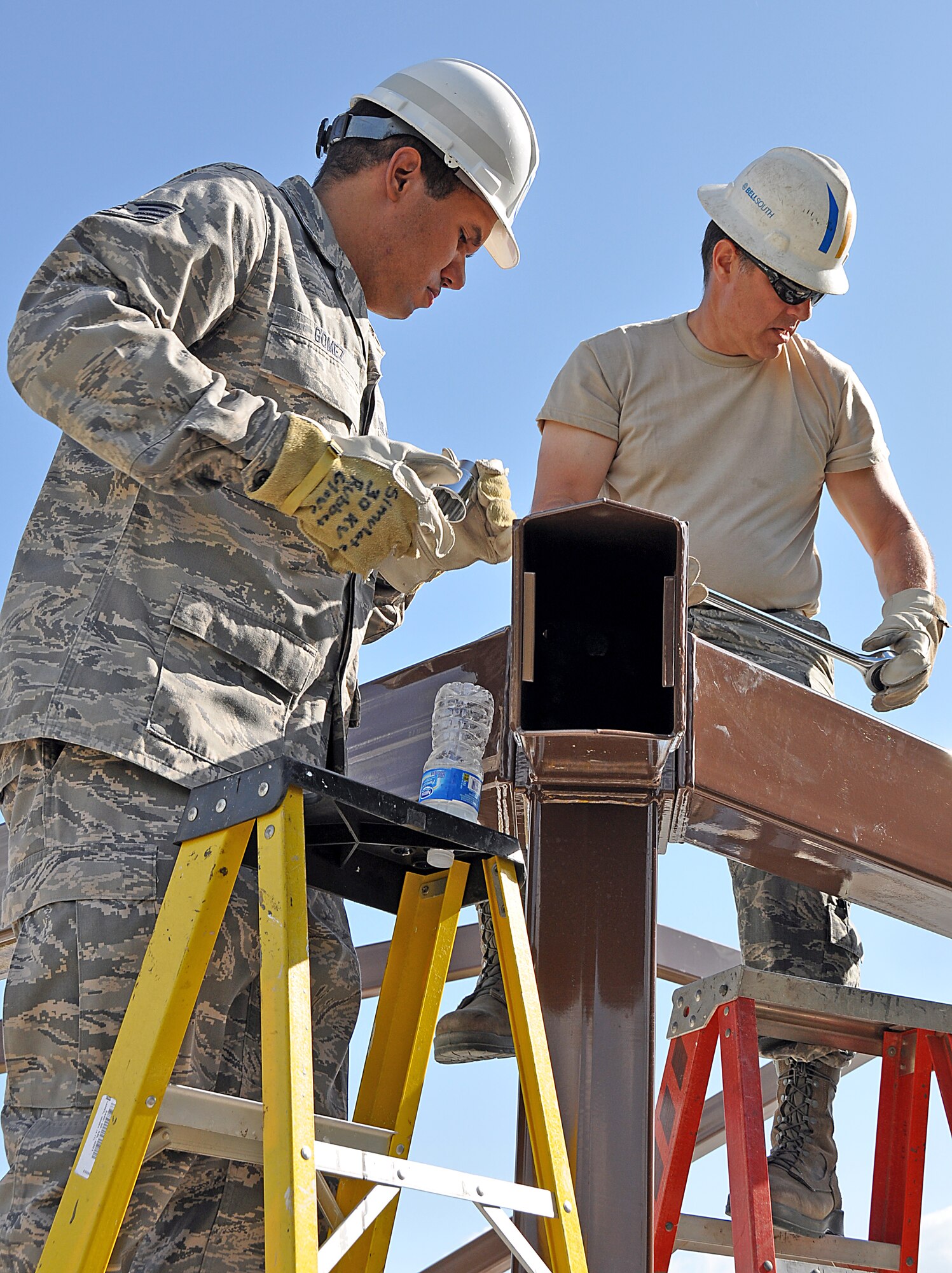Staff Sgt. Osmani Gomez, Electrical Systems Journeyman, 482 Civil Engineering Squadron  and Tech Sgt. Joseph Vazquez, Electrical Systems Craftsman, 482 Civil Engineering Squadron work on the squadrons new pavilion. The construction of the pavilion helped many of the Civil Engineering Squadron's Airmen gain hands on experience in their different jobs. (U. S. Air Force Photo/Senior Airman Jacob Jimenez, 482nd Fighter Wing Public Affairs).