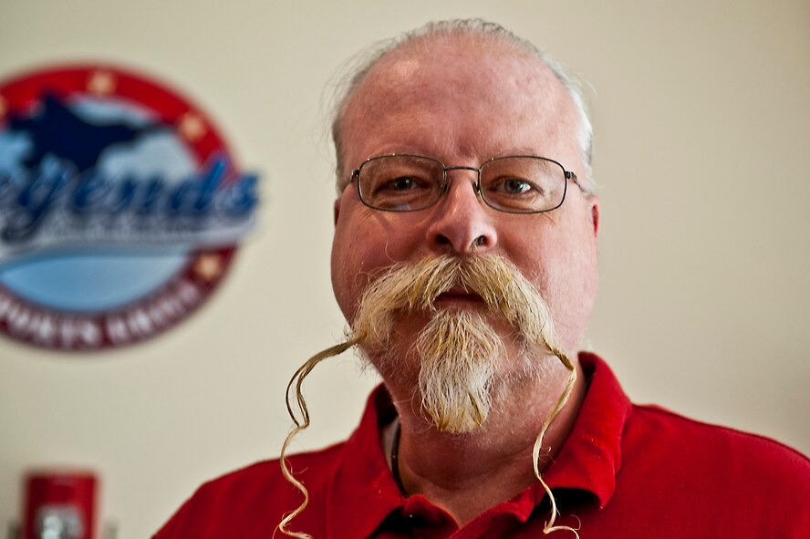 Les Matheson, a retired lieutenant colonel, claimed first prize in Eglin’s first-ever Mustache Madness contest at Legends Sports Grill, March 30.  Runners up received novelty awards for a variety of categories including Most Fitting, Most Outrageous and Most Disturbing.  The 96th Air Base Wing Commander, Col. Sal Nodjomian, along with three other judges chose from among both military and civilian contestants. (U.S. Air Force photo/Randy Gon) 
