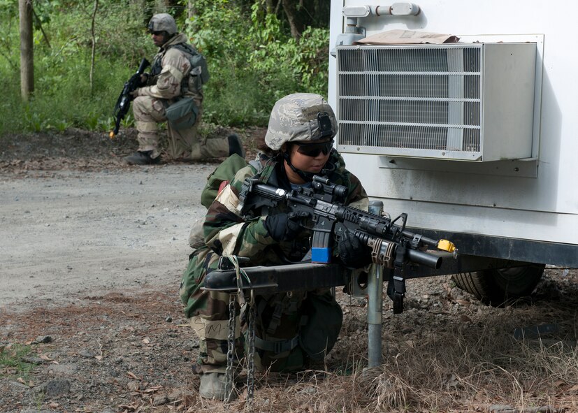 U.S. Air Force Airman 1st Class Angela Jones, 23d Security Forces Squadron, provides security at an entry control point with another member of the 23d SFS during a phase II operational readiness inspection at the field training exercise site March 30, 2012, at Moody Air Force Base, Ga. Team Moody has been preparing for the arrival of the inspectors by training for the past eight months with operational readiness exercises. (U.S. Air Force photo by Senior Airman Eileen Meier/Released)