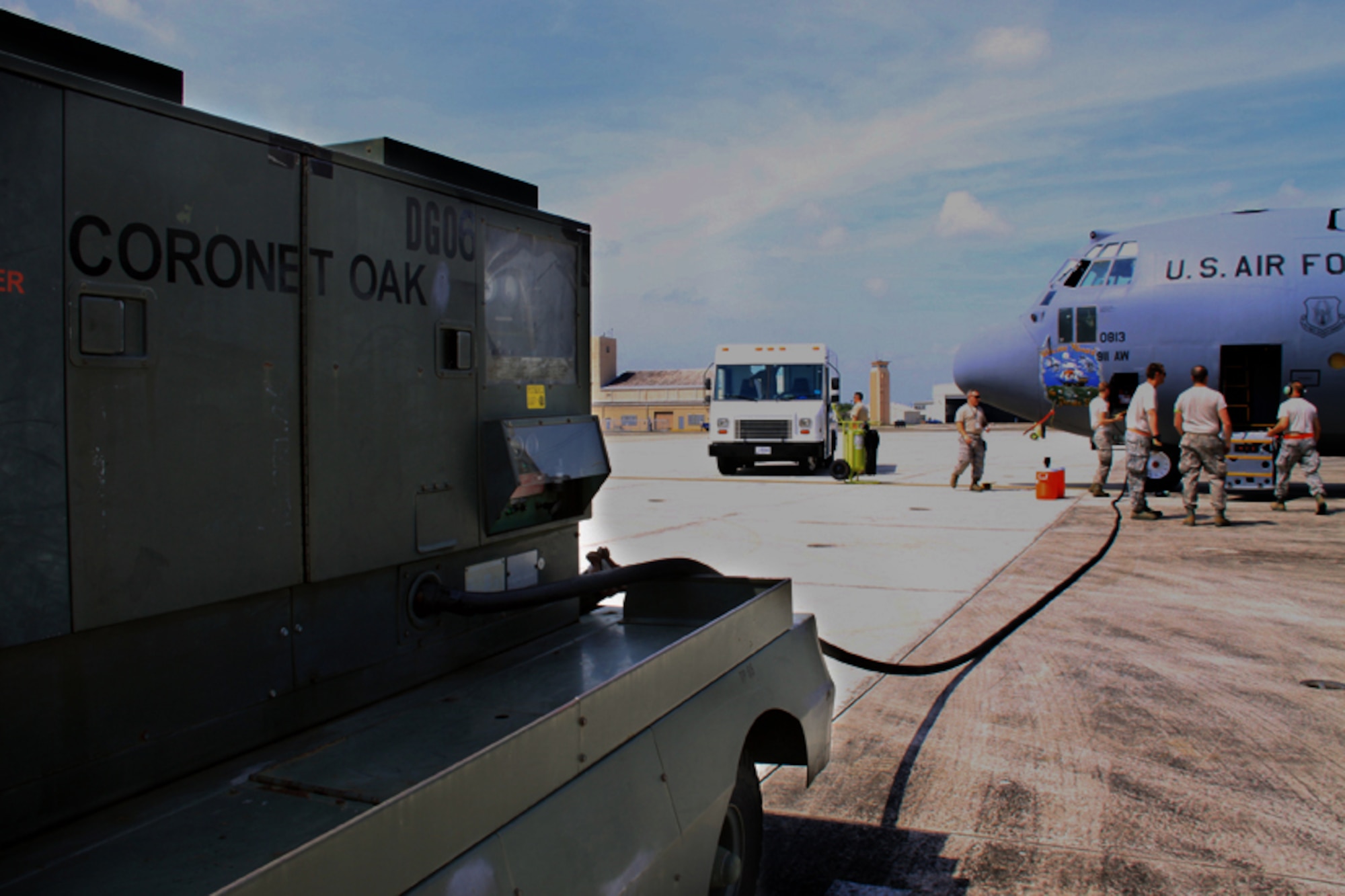 Maintenance personnel from the 911th Airlift Wing unseal aircraft 813 and begin to perform a preflight inspection on April 2, 2012.  An aircraft must be fully inspected and then sealed prior to entering an alert status.  Unit members arrived in Muniz, Puerto Rico on March 31, 2012, to support 'Coronet Oak' missions flying throughout the U.S. Southern Command area of responsibility.  (U.S. Air Force photo by Capt. Shawn M. Walleck/Released) 

