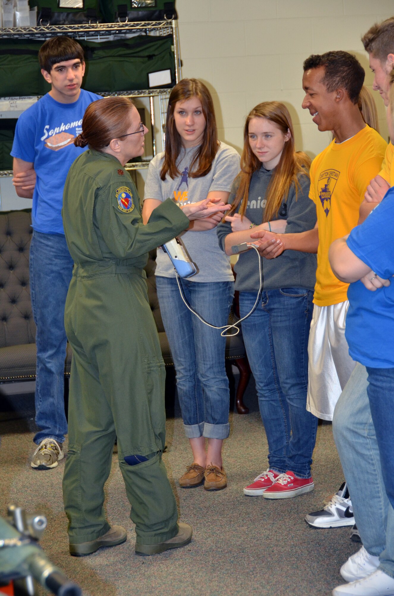 WRIGHT-PATTERSON AIR FORCE BASE, Ohio – Major Sharon Ellis, 445th Aeromedical Evacuation Squadron flight nurse, talks to students from Dayton Christian High School about her role with AES and demonstrates some of the equipment she uses as part of her job during their visit to the unit March 20. Thirty four students from the school spent the afternoon learning about the 445th AES as part of their visit to the base. (U.S. Air Force photo/Stacy Vaughn)