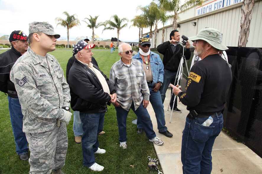 Volunteers help assemble The Wall that Heals, a traveling replica of the Vietnam Memorial Wall, at the March Field Air Museum Monday. The Wall that Heals will be on display through the weekend. (U.S. Air Force photo by Carson Hampton) 
