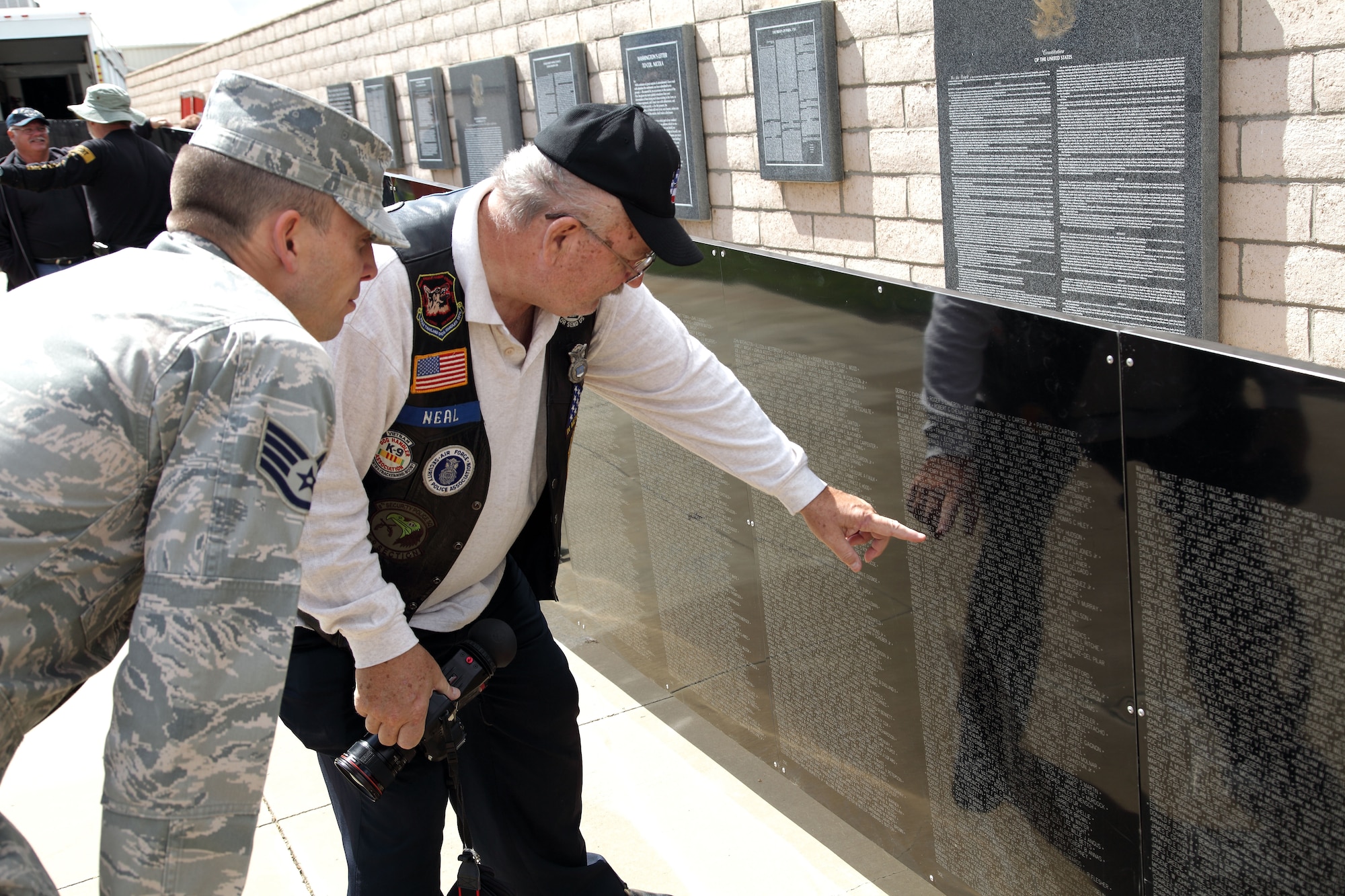 Volunteers help assemble The Wall that Heals, a traveling replica of the Vietnam Memorial Wall, at the March Field Air Museum Monday. The Wall that Heals will be on display through the weekend. (U.S. Air Force photo by Carson Hampton) 
