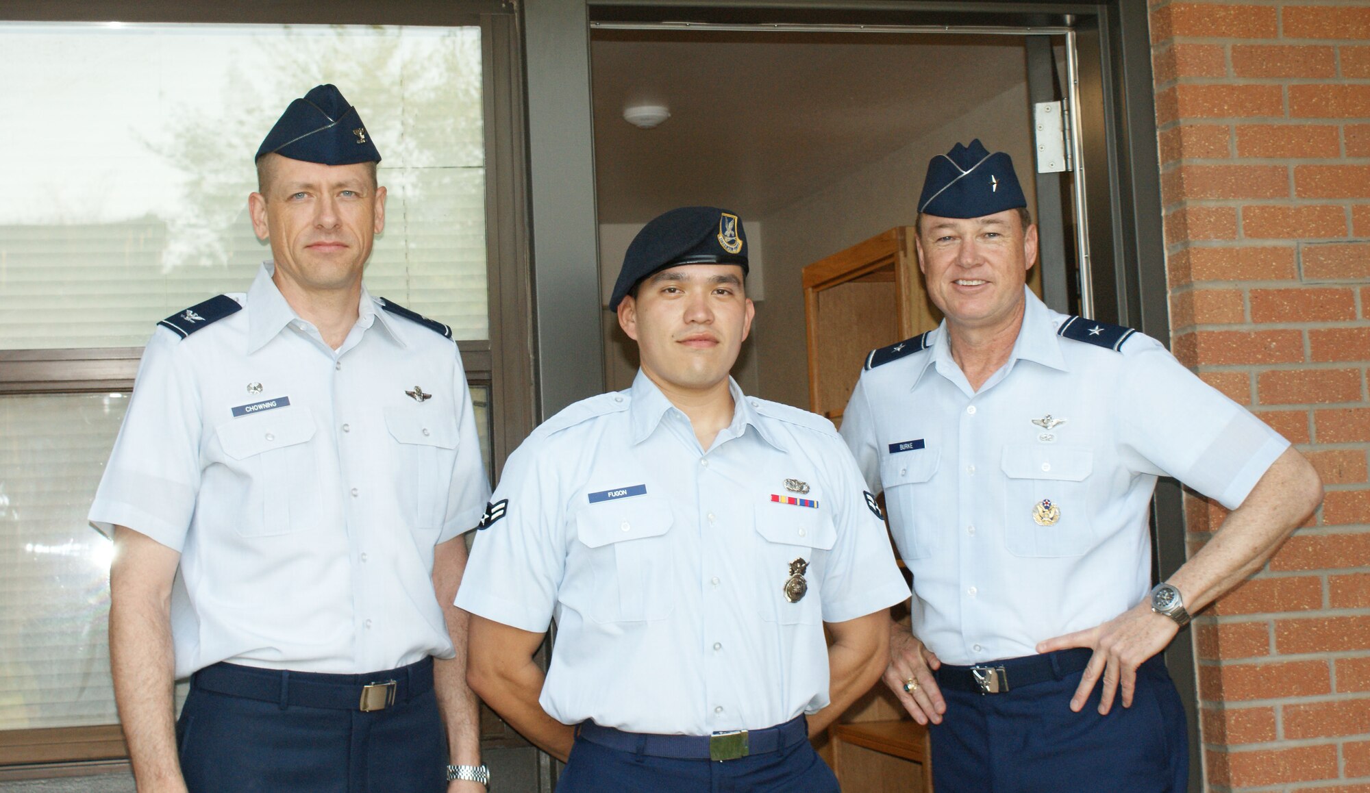 Brig. Gen. Darryl Burke, 82nd Training Wing commander, and Col. Scott Chowning, 82nd Mission Support Group commander, with Airman 1st Class Isaac Fugon,82nd Security Forces Squadron, at a dedication ceremony for the newly renovated building 527 dormitory Apr. 2, 2012 at Sheppard Air Force Base, Texas. The renovation project signficantly upgraded the building's air-conditioning system, along with new carpeting, paint and entry key system. (U.S. Air Force photo/Dan Hawkins)