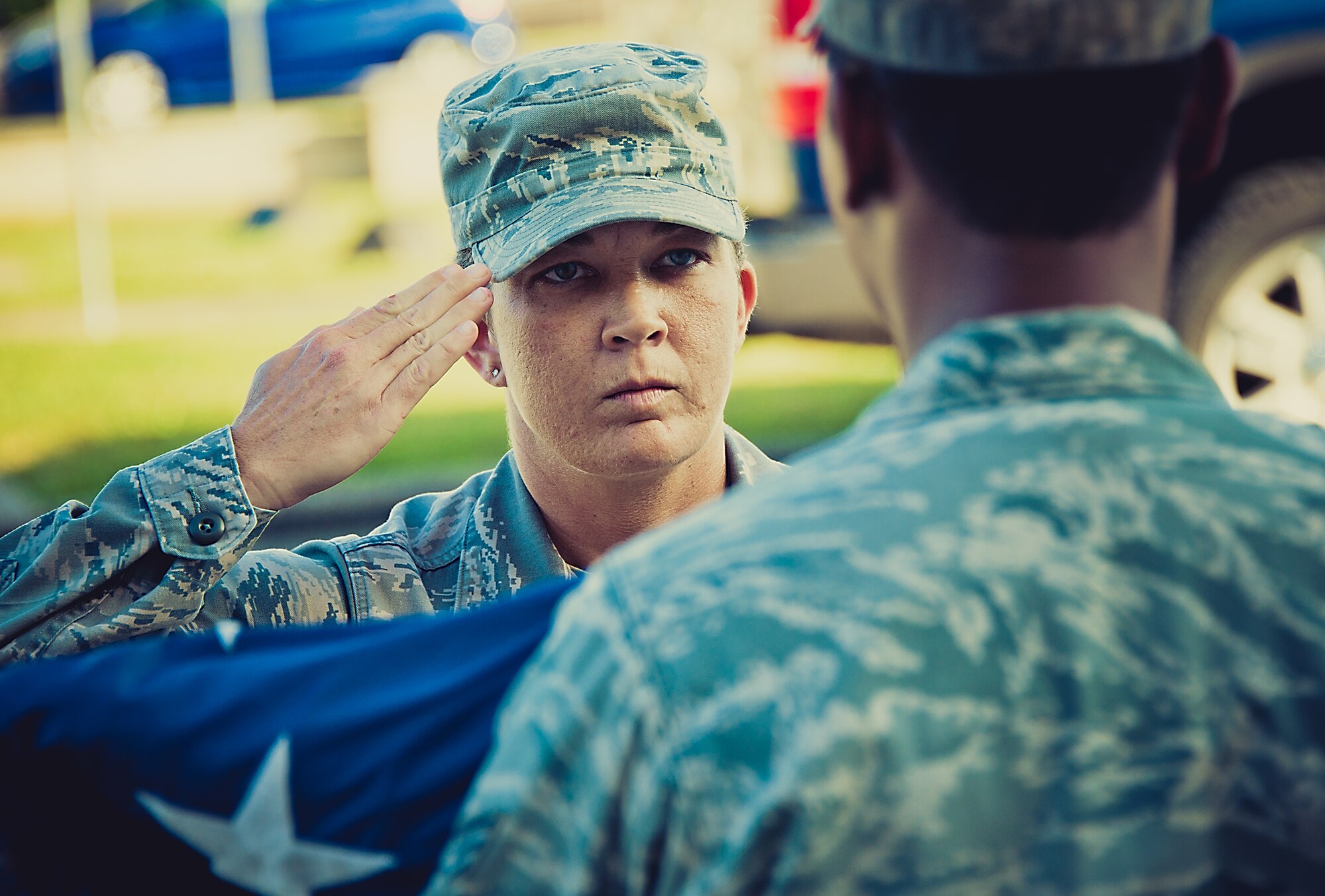 Master Sgt. Deaira Smith, Air Force Operational Test and Evaluation Center, Detachment 2, salutes after retiring the colors at the retreat ceremony March 29.  The flag detail and flight positions were filled by women in honor of Women’s History Month.  More than 30 women participated in the ceremony.  To see more photos of the all-women flag detail go to facebook.com/teameglin.  (U.S. Air Force photo/Samuel King Jr.)