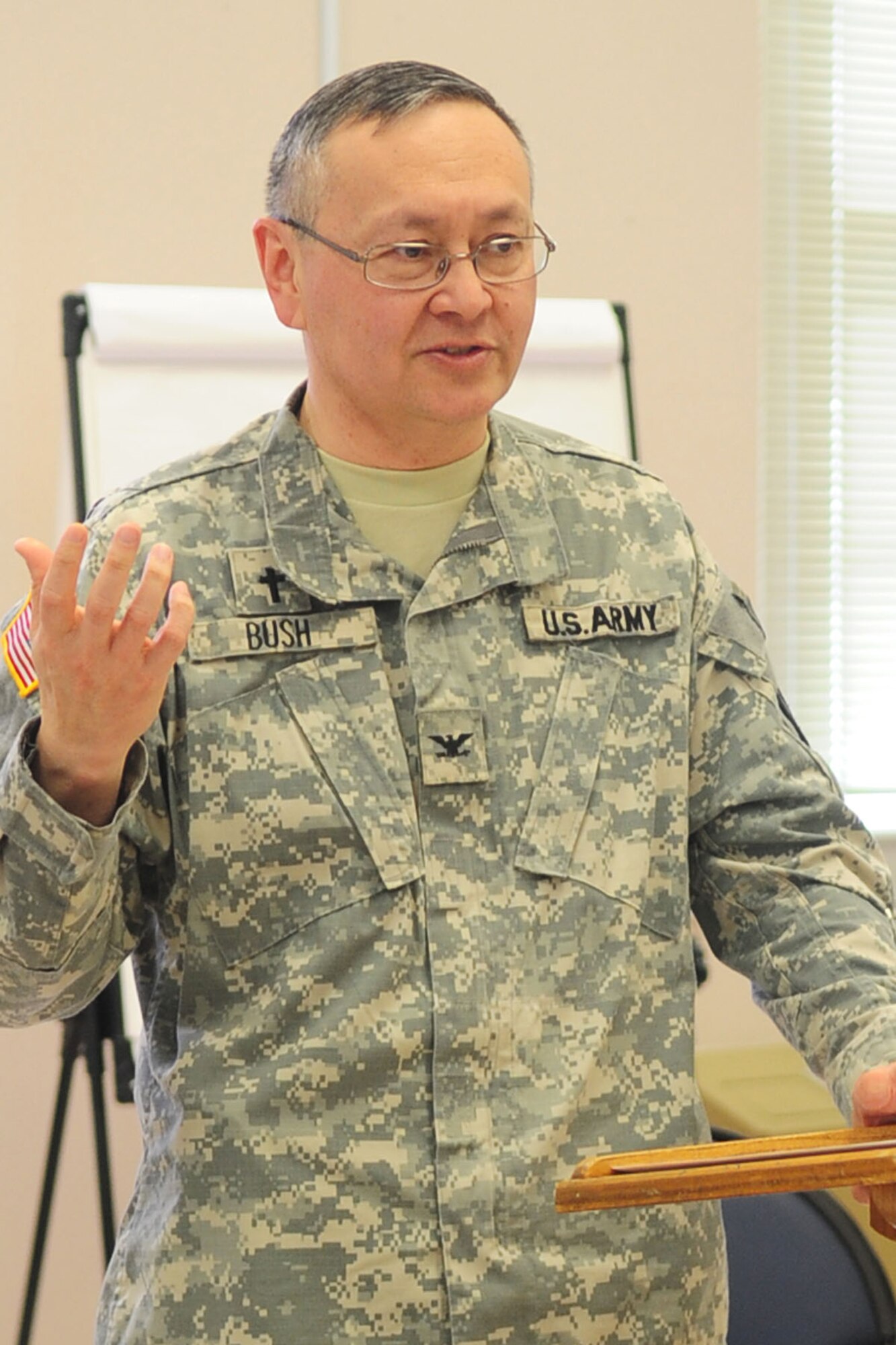 U.S. Army Chap. (Col.) Kenneth Bush, 733rd Mission Support Group senior chaplain, addresses the audience during a suicide prevention symposium at Fort Eustis, Va., March 29, 2012. Counseling specialists delivered short addresses on suicide prevention and alcohol and substance abuse treatment to unit chaplains. (U.S. Air Force photo by Staff Sgt. Ashley Hawkins/Released)