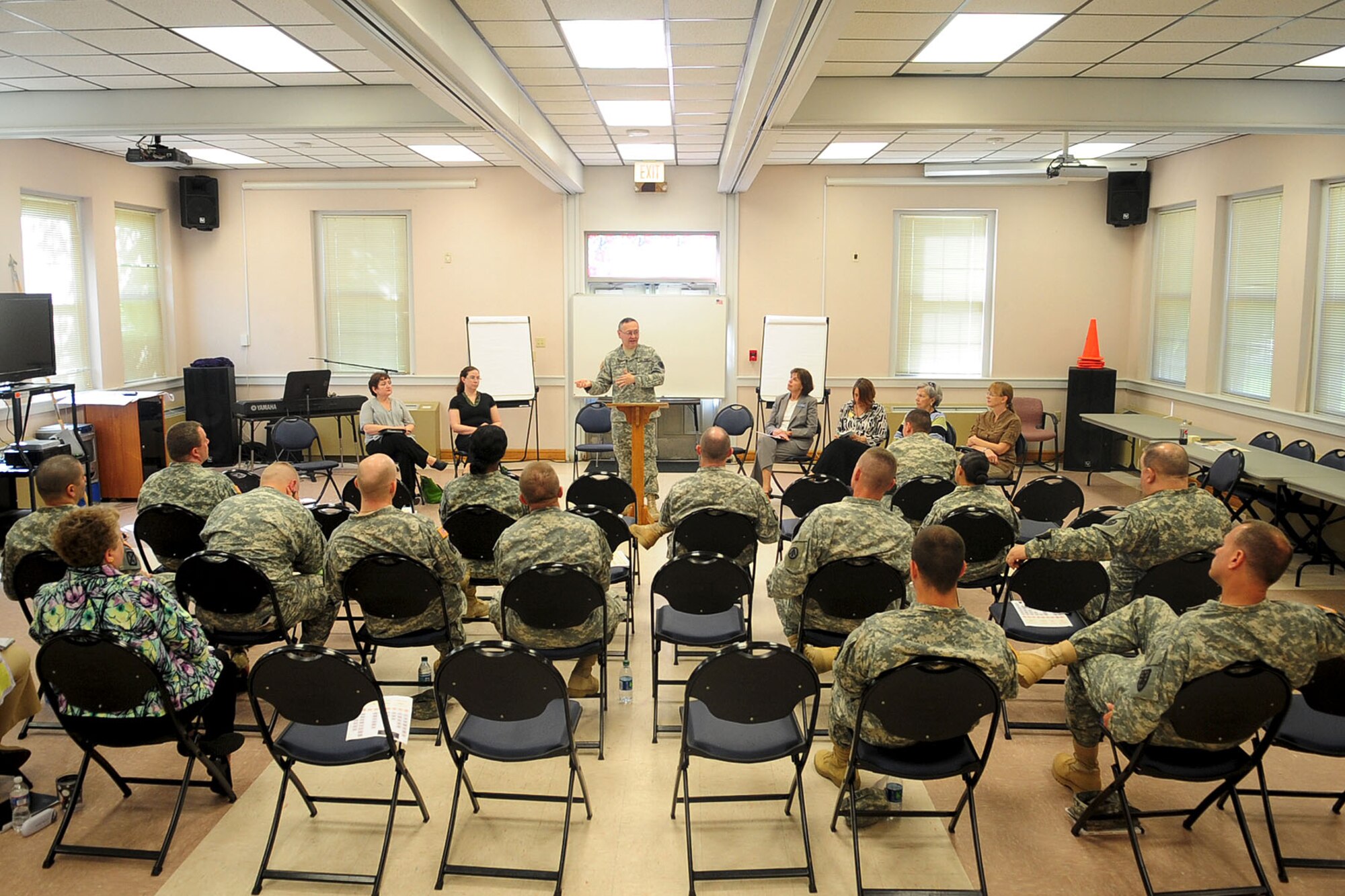 U.S. Army Chap. (Col.) Kenneth Bush, 733rd Mission Support Group senior chaplain, speaks during a suicide prevention symposium at Fort Eustis, Va., March 29, 2012. The social gathering promoted an exchange of ideas from chaplains, chaplain assistants and military counseling organizations on how to combat suicide across Fort Eustis. (U.S. Air Force photo by Staff Sgt. Ashley Hawkins/Released)