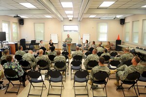 U.S. Army Chap. (Col.) Kenneth Bush, 733rd Mission Support Group senior chaplain, speaks during a suicide prevention symposium at Fort Eustis, Va., March 29, 2012. The social gathering promoted an exchange of ideas from chaplains, chaplain assistants and military counseling organizations on how to combat suicide across Fort Eustis. (U.S. Air Force photo by Staff Sgt. Ashley Hawkins/Released)