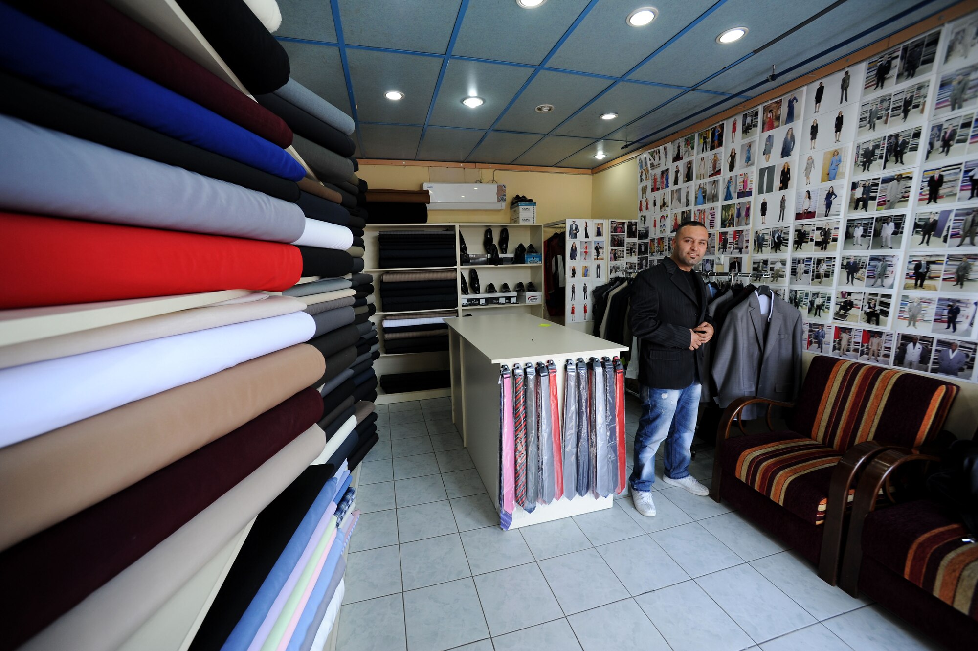 Mustafa Tiken, Couzin's Tailor Shop owner, displays a custom-made jacket March 29, 2012, in Incirlik Village, Turkey. Couzin's Tailor Shop is registered with the Incirlik Village Merchants Association, which was founded approximately 20 years ago with the objective to improve relationships with American customers. (U.S. Air Force photo by Senior Airman Jarvie Z. Wallace/Released) 