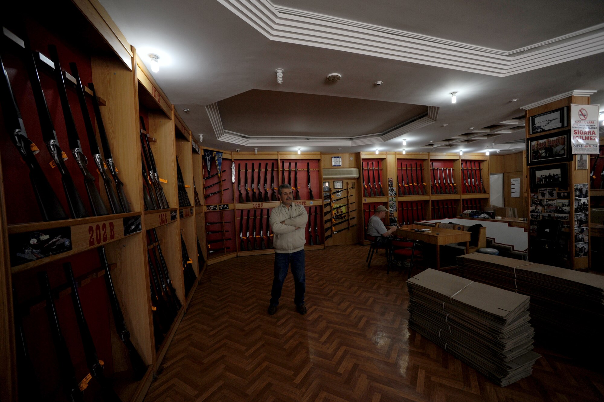 Osman Ceteci, Silver Eagle Huglu Shotgun Store sales manager, awaits customers March 29, 2012, in Incirlik Village, Turkey. The store is registered with the Incirlik Village Merchants Association, which was founded approximately 20 years ago with the objective to improve relationships with American customers. (U.S. Air Force photo by Senior Airman Jarvie Z. Wallace/Released)