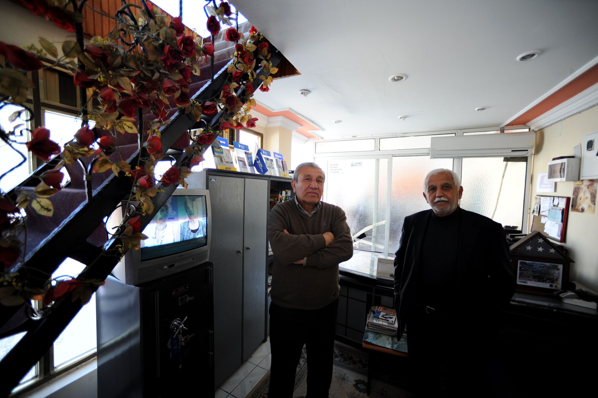 Ali Kesen, left, Cenkar Travel Agency & Rent A Car manager, and Ali Kar, Cenkar owner, await customers March 29, 2012, in Incirlik Village, Turkey. Cenkar Travel Agency & Rent A Car is registered with the Incirlik Village Merchants Association, which was founded approximately 20 years ago with the objective to improve relationships with American customers. (U.S. Air Force photo by Senior Airman Jarvie Z. Wallace/Released)
