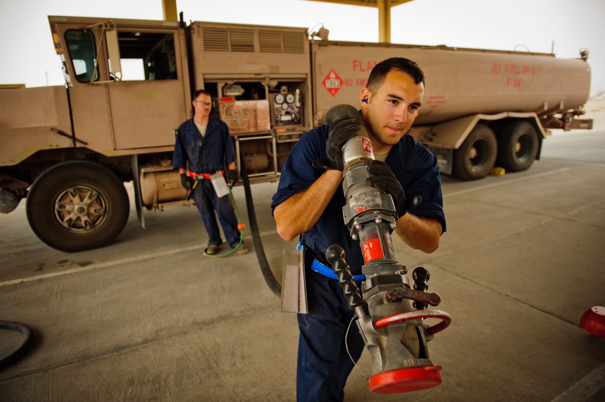 SOUTHWEST ASIA – Senior Airman Cameron Farrell, 379th Expeditionary Logistics Readiness Squadron refueling maintenance technician, pulls a hose from a fuel truck during an inspection March 30, 2012. The preventative maintenance team inspects the hoses, gauges, and grounding wires, as well as various vehicle functions on every refueling units in their inventory. (U.S. Air Force photo/Staff Sgt. Nathanael Callon)