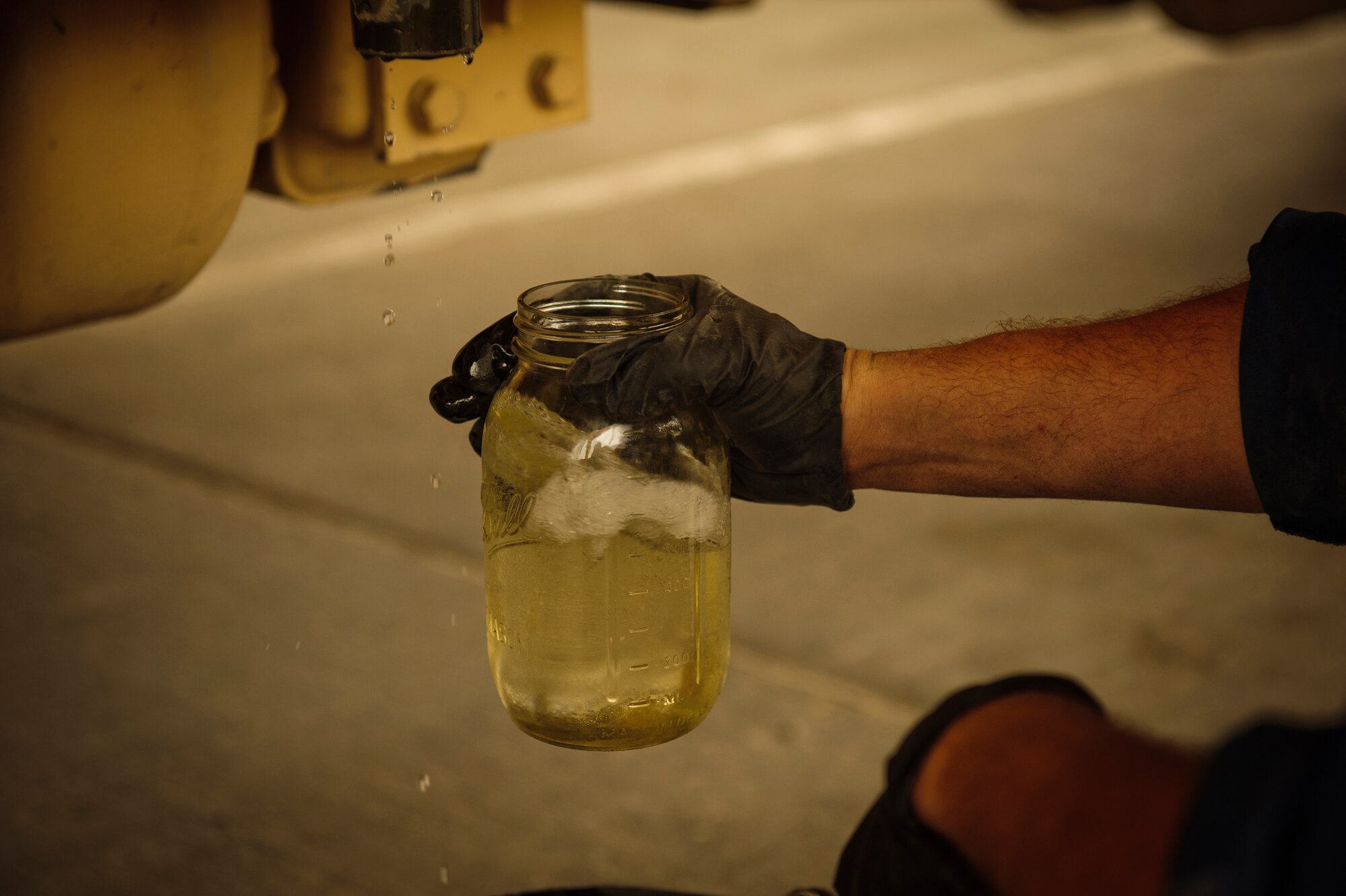 SOUTHWEST ASIA – Staff Sgt. Daniel Zickefoose, 379th Expeditionary Logistics Readiness Squadron refueling maintenance technician, checks fuel for water and sediment March 30, 2012. If the fuel has water or sediment in it, it indicates that the fuel could be contaminated, meaning it cannot be loaded into aircraft on base. (U.S. Air Force photo/Staff Sgt. Nathanael Callon)