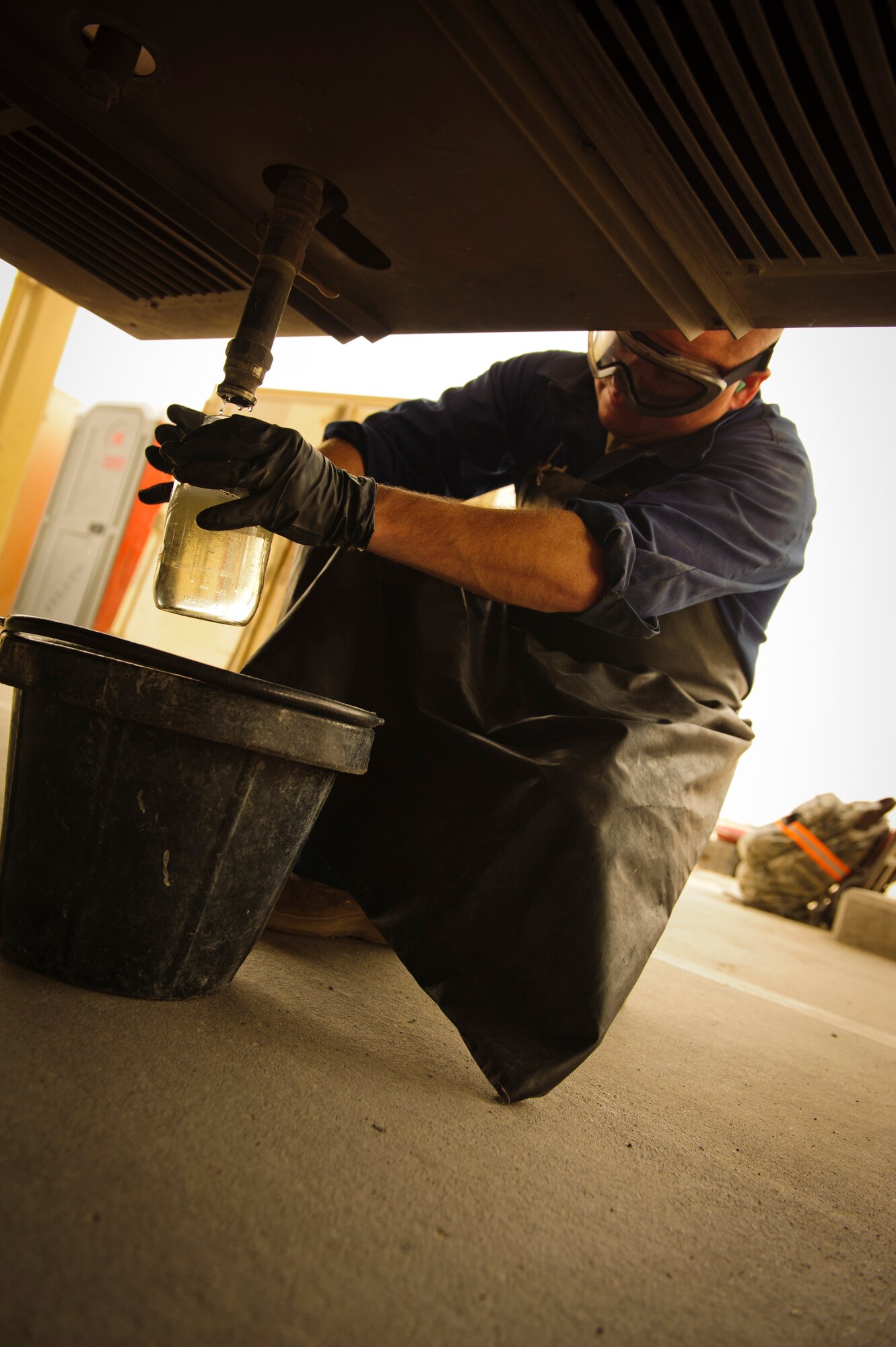 SOUTHWEST ASIA – Staff Sgt. Daniel Zickefoose, 379th Expeditionary Logistics Readiness Squadron refueling maintenance technician, checks fuel for water nad sediment March 30, 2012. If the fuel has water or sediment in it, it indicates that the fuel could be contaminated, meaning it cannot be loaded into aircraft on base. (U.S. Air Force photo/Staff Sgt. Nathanael Callon)