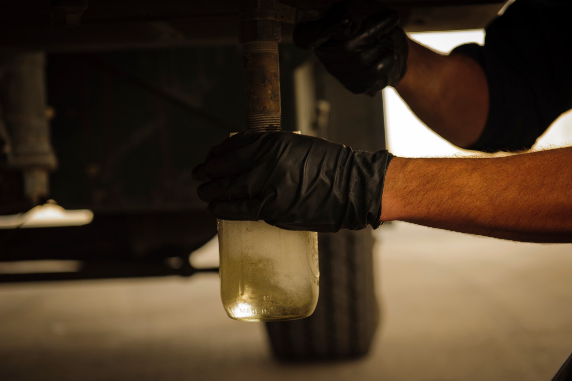 SOUTHWEST ASIA – Staff Sgt. Daniel Zickefoose, 379th Expeditionary Logistics Readiness Squadron refueling maintenance technician, checks fuel for water and sediment March 30, 2012. If the fuel has water or sediment in it, it indicates that the fuel could be contaminated, meaning it cannot be loaded into aircraft on base. (U.S. Air Force photo/Staff Sgt. Nathanael Callon)