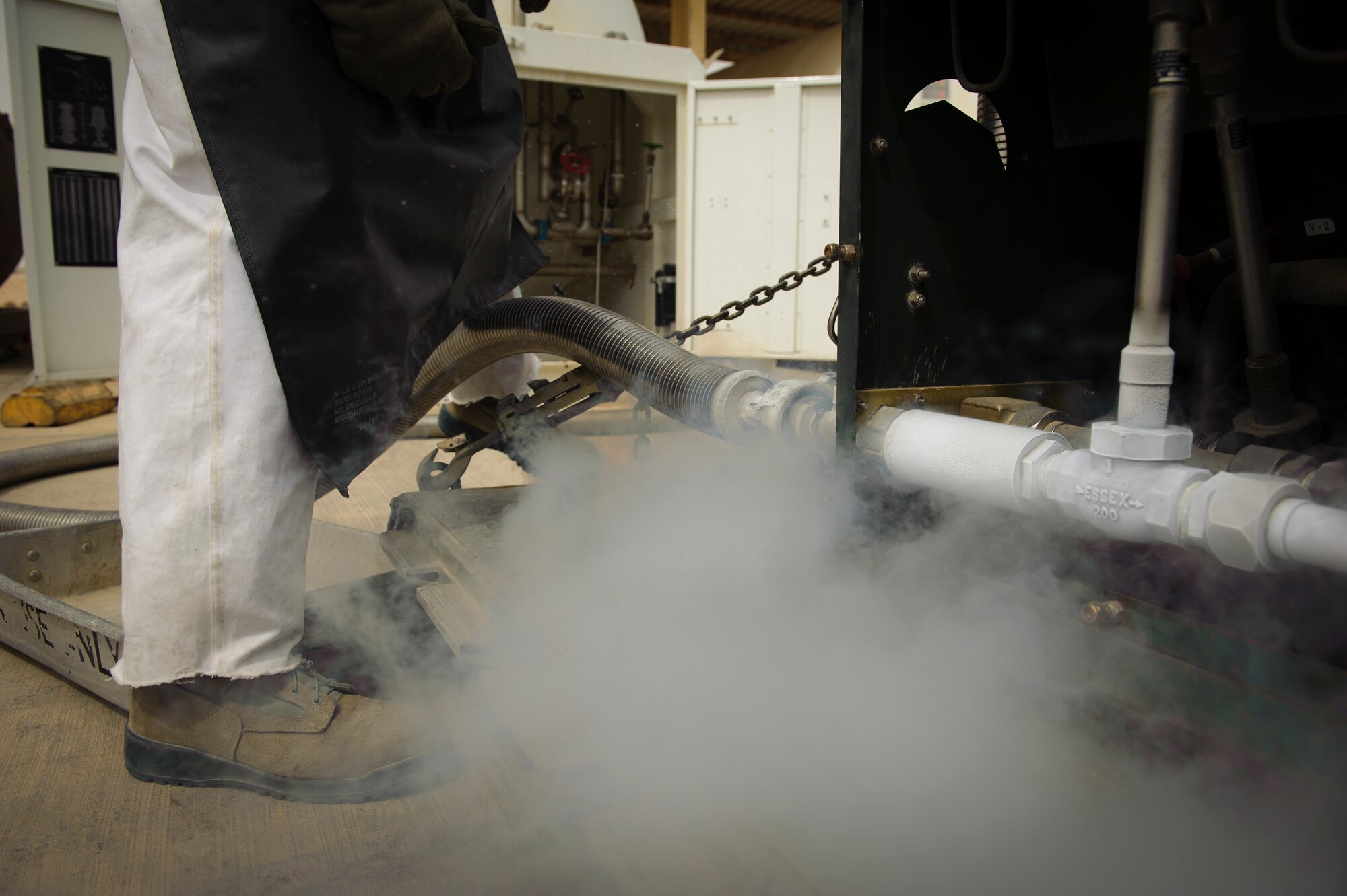 SOUTHWEST ASIA – Staff Sgt. Brandon Wilson, 379th Expeditionary Logistics Readiness Squadron cryogenics supervisor, fills a tank with liquid oxygen here March 29, 2012. Liquid oxygen has a freezing point of -368.77-degrees Fahrenheit. (U.S. Air Force photo/Staff Sgt. Nathanael Callon)