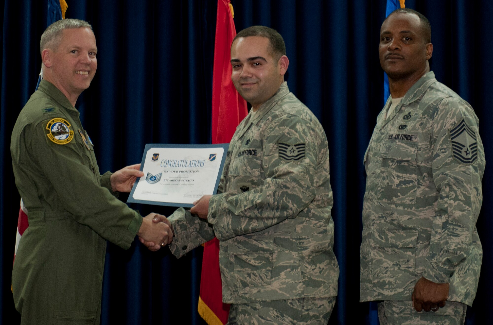 Ricardo Santiago, 39th Security Forces Squadron, is promoted to the rank of technical sergeant March 30, 2012, at the Club Complex ballroom at Incirlik Air Base, Turkey. (U.S. Air Force photo by Senior Airman Anthony Sanchelli/Released)