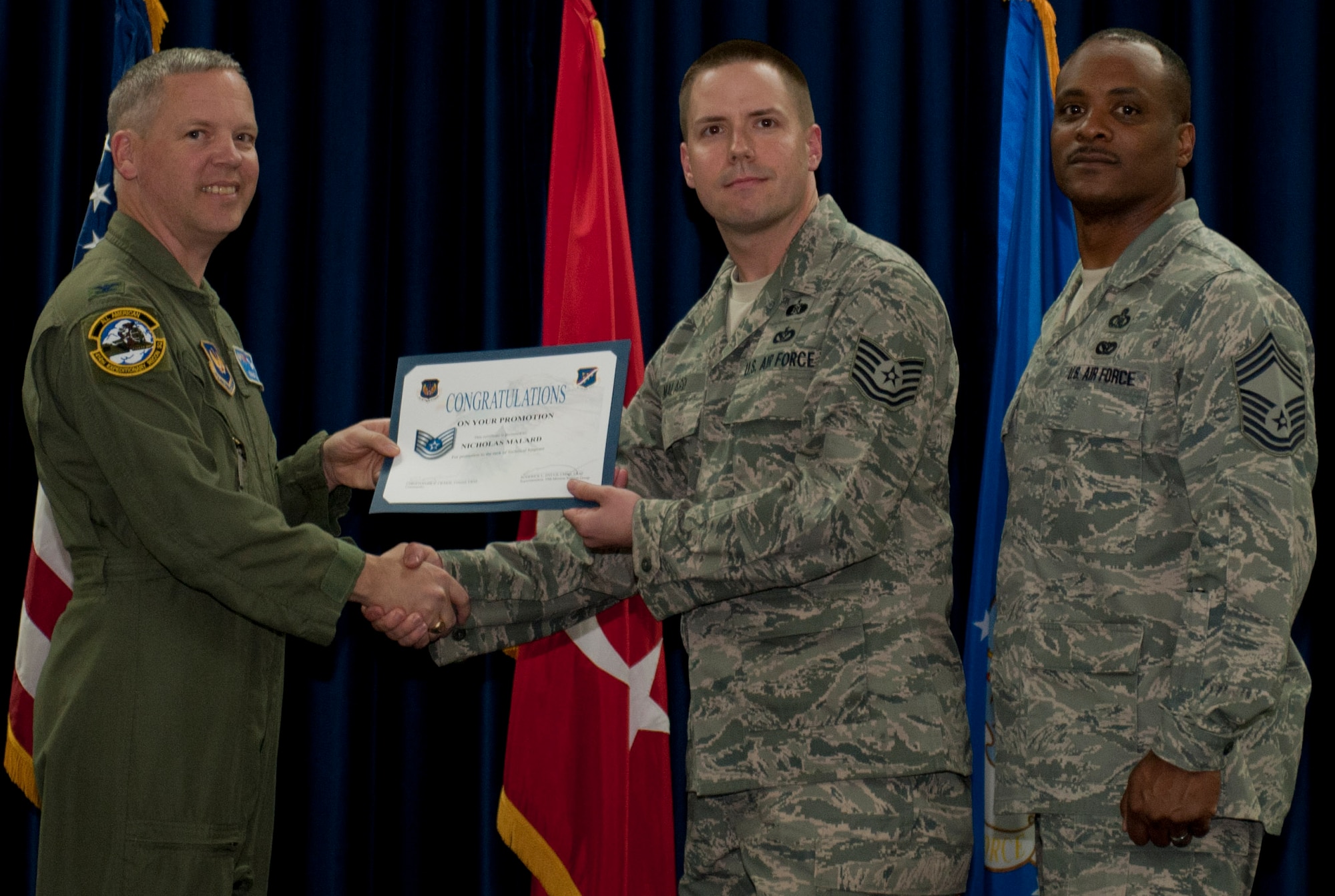 Nicholas Malard, 39th Civil Engineer Squadron, is promoted to the rank of technical sergeant March 30, 2012, at the Club Complex ballroom at Incirlik Air Base, Turkey. (U.S. Air Force photo by Senior Airman Anthony Sanchelli/Released)