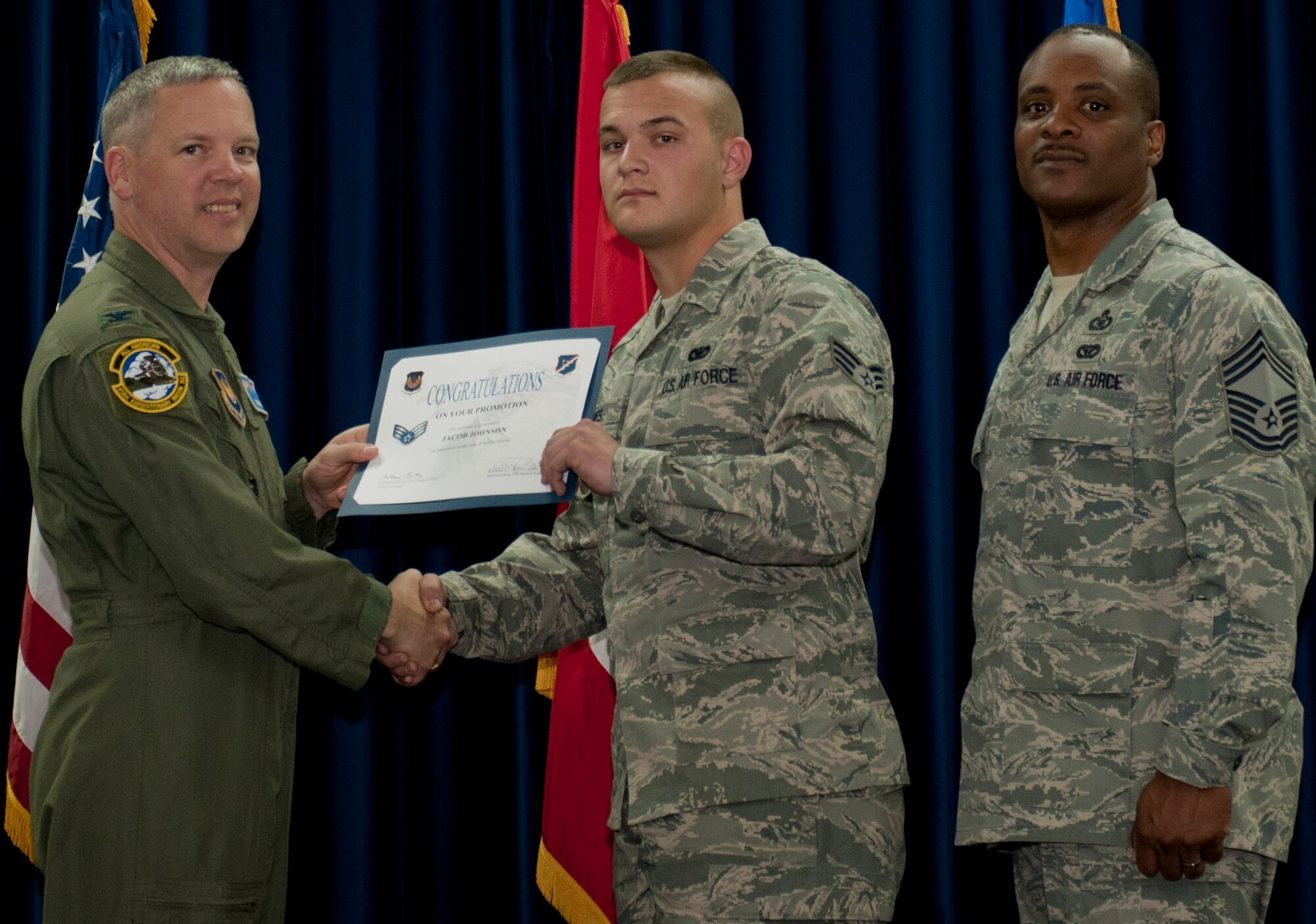 Jacob Johnson, 39th Civil Engineer Squadron, is promoted to the rank of senior airman March 30, 2012, at the Club Complex ballroom at Incirlik Air Base, Turkey. (U.S. Air Force photo by Senior Airman Anthony Sanchelli/Released)