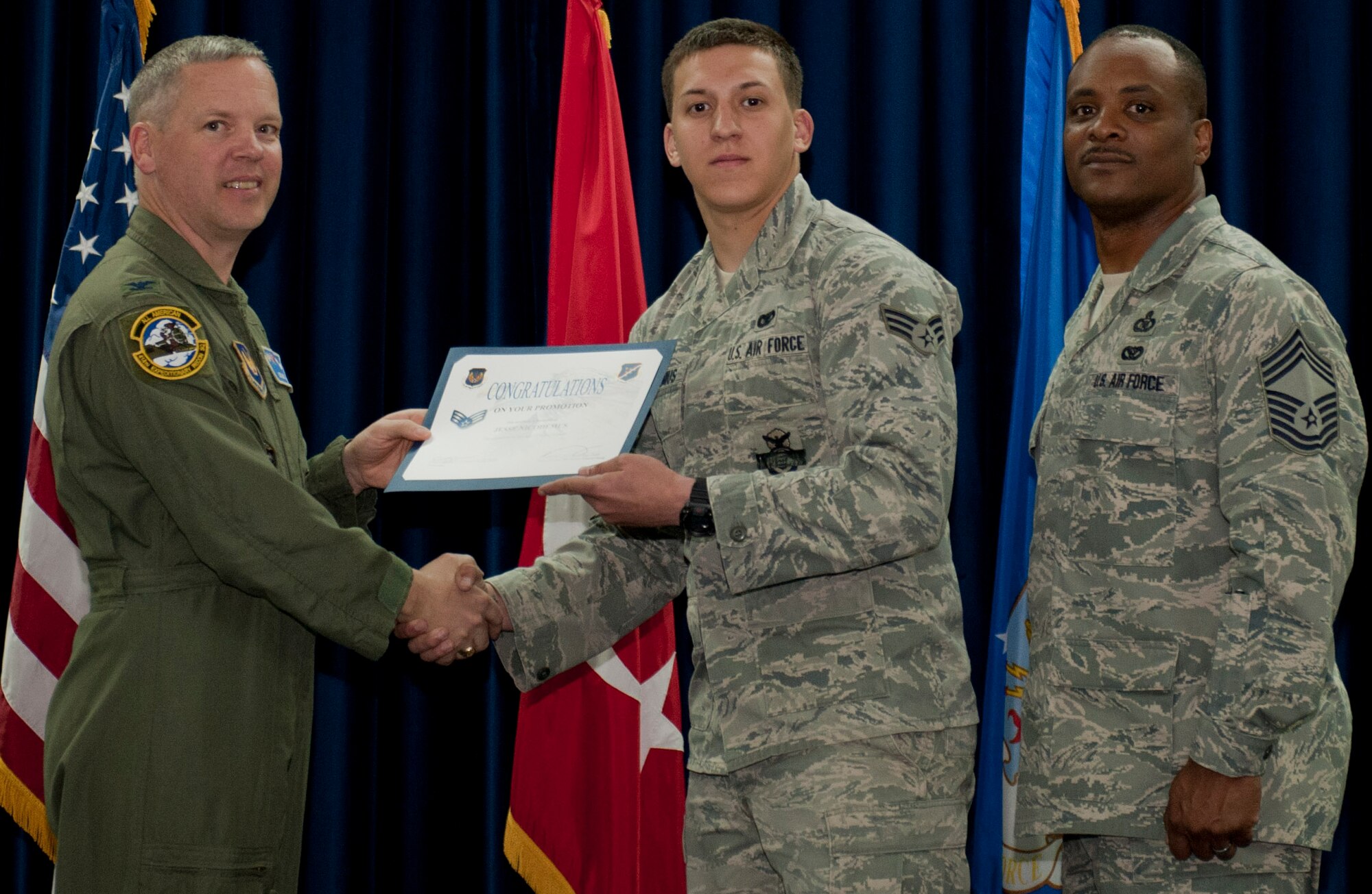 Jesse Nicodemus, 39th Security Forces Squadron, is promoted to the rank of senior airman March 30, 2012, at the Club Complex ballroom at Incirlik Air Base, Turkey. (U.S. Air Force photo by Senior Airman Anthony Sanchelli/Released)