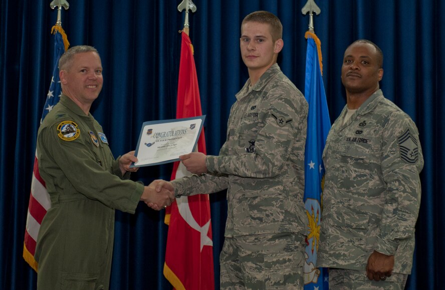 Bradie Oslager, 39th Security Forces Squadron, is promoted to the rank of airman March 30, 2012, at the Club Complex ballroom at Incirlik Air Base, Turkey. (U.S. Air Force photo by Senior Airman Anthony Sanchelli/Released)