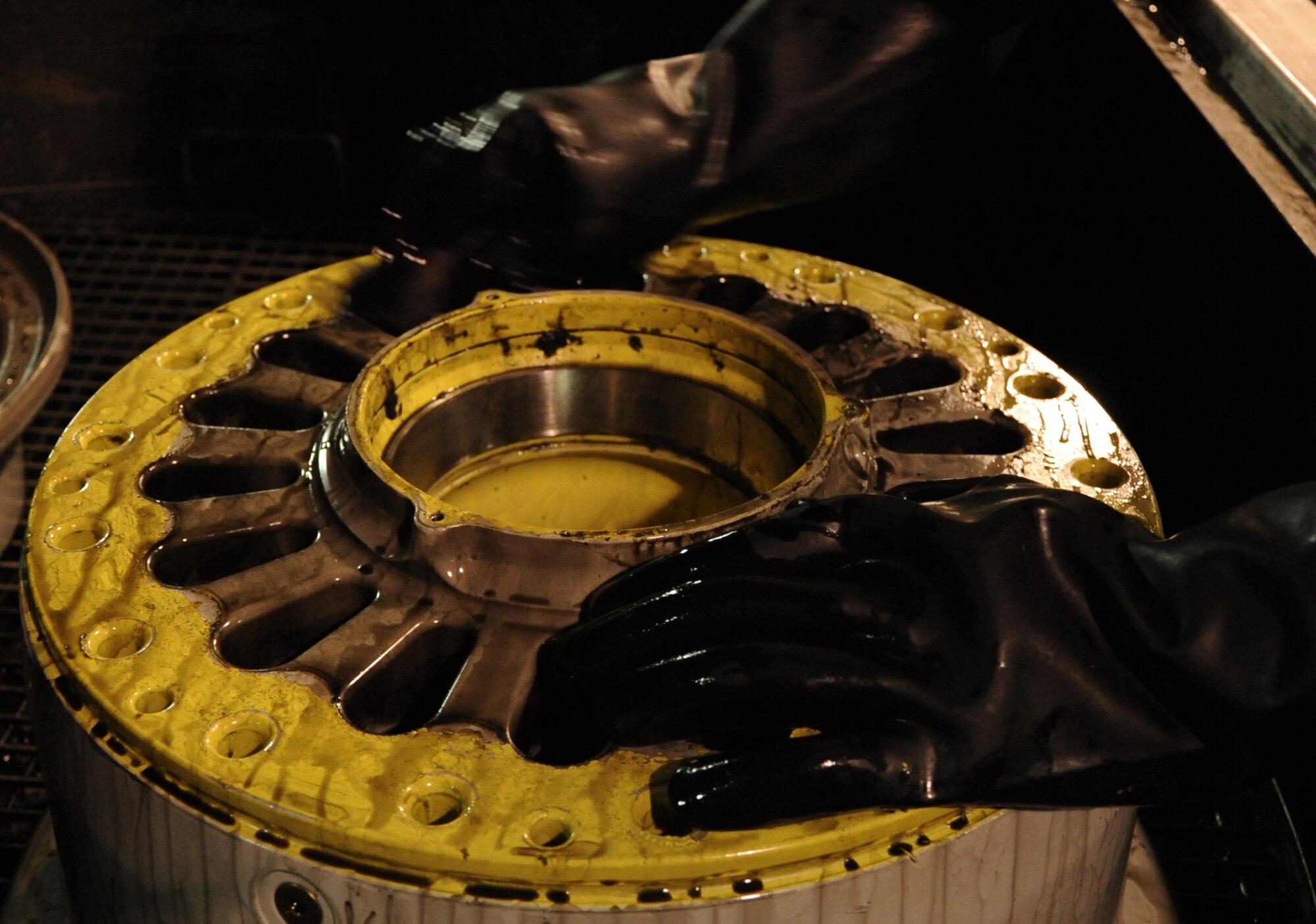 SOUTHWEST ASIA – Staff Sgt. Michael Trotter, 379th Expeditionary Maintenance Squadron Wheel and Tire Shop technician and native of Pensacola, Fla., cleans an aircraft wheel rim during a routine inspection March 29. During the cleaning Trotter checked the rim for noticeable damage and cleaned away carbon buildup that could compromise its integrity. The wheel and tire shop conducts wheel and tire maintenance services and inspections for seven different airframes including the F-16, C-130, KC-135, and B-1. It also supports wheel and tire services from bases throughout Southwest Asia. Trammell is currently deployed from Kessler AFB, Miss. 