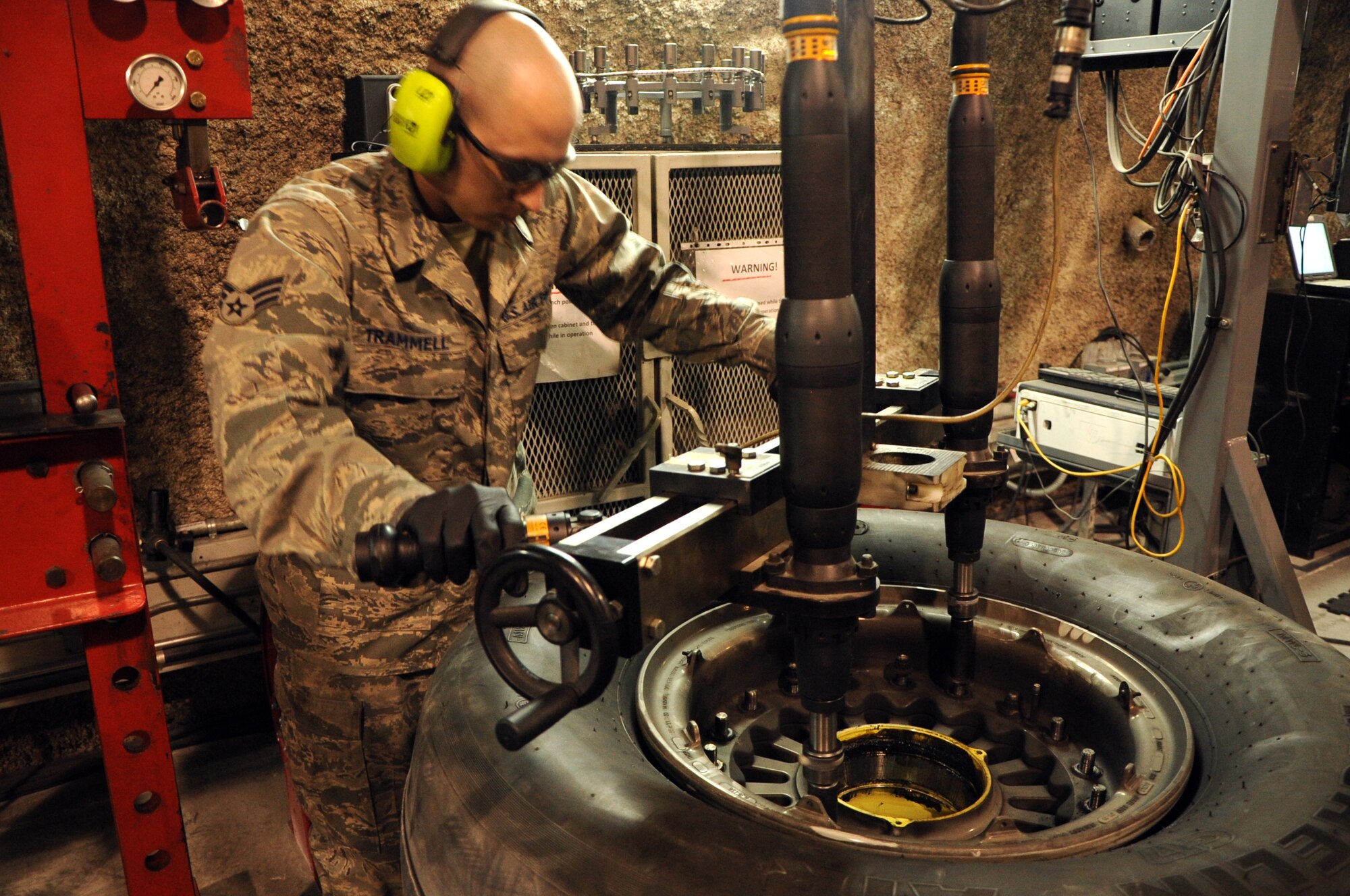 SOUTHWEST ASIA – Senior Airman Blake Trammell, 379th Expeditionary Maintenance Squadron Wheel and Tire Shop technician and native of Birmingham, Ala., removes the lug nuts from an aircraft wheel during a routine inspection March 29. The wheel and tire shop conducts wheel and tire maintenance services and inspections for seven different airframes including the F-16, C-130, KC-135, and B-1. It also supports wheel and tire services from bases throughout Southwest Asia. Trammell is currently deployed from McConnell AFB, Kan. 