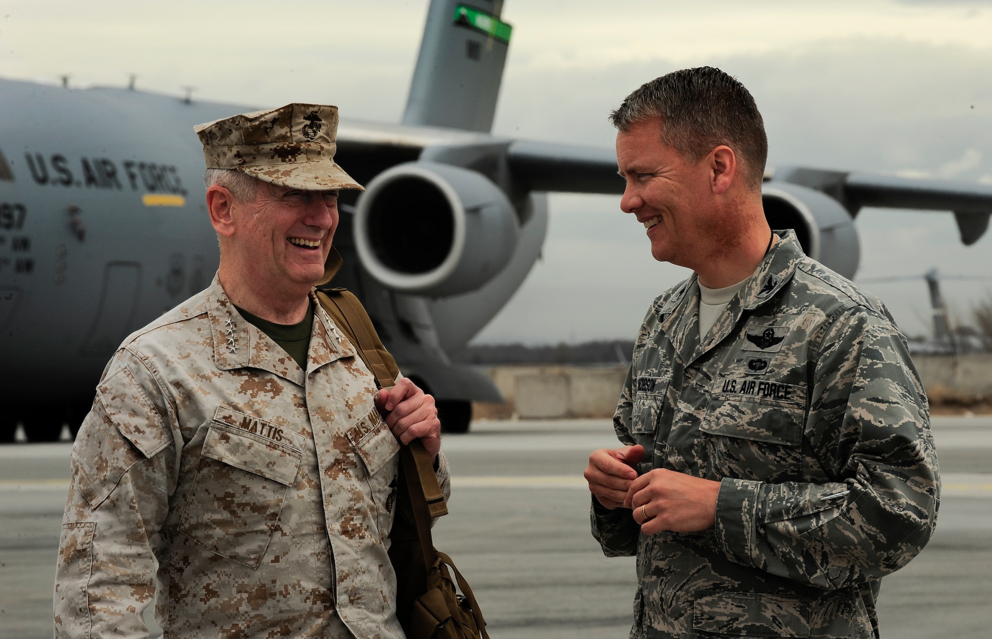 U.S. Marine Corps Gen. James Mattis laughs with U.S. Air Force Col. James Jacobson April 1, 2012, during Gen. Mattis' visit to the Transit Center at Manas, Kyrgyzstan. Mattis is the commander of U.S. Central Command and Jacobson is the commander of the 376th Air Expeditionary Wing. (U.S. Air Force photo/Staff Sgt. Angela Ruiz)
