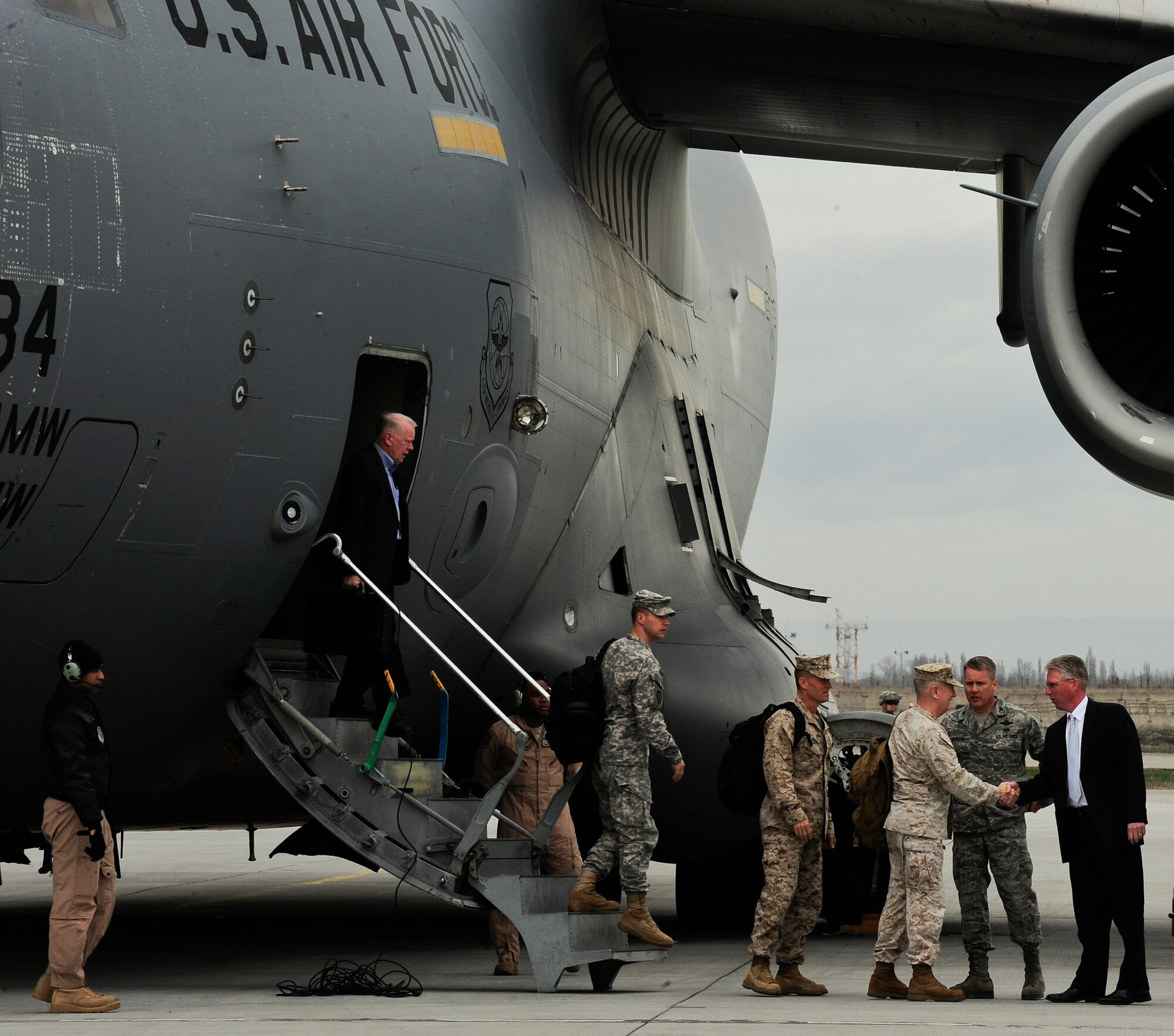 U.S. Marine Corps Gen. James Mattis shakes hands with David McCormick after exiting a C-17 Globemaster III April 1, 2012, at the Transit Center at Manas, Kyrgyzstan. Mattis is the commander of U.S. Central Command and McCormick is the acting deputy chief of mission for the U.S. Embassy in Bishkek. (U.S. Air Force photo/Staff Sgt. Angela Ruiz)