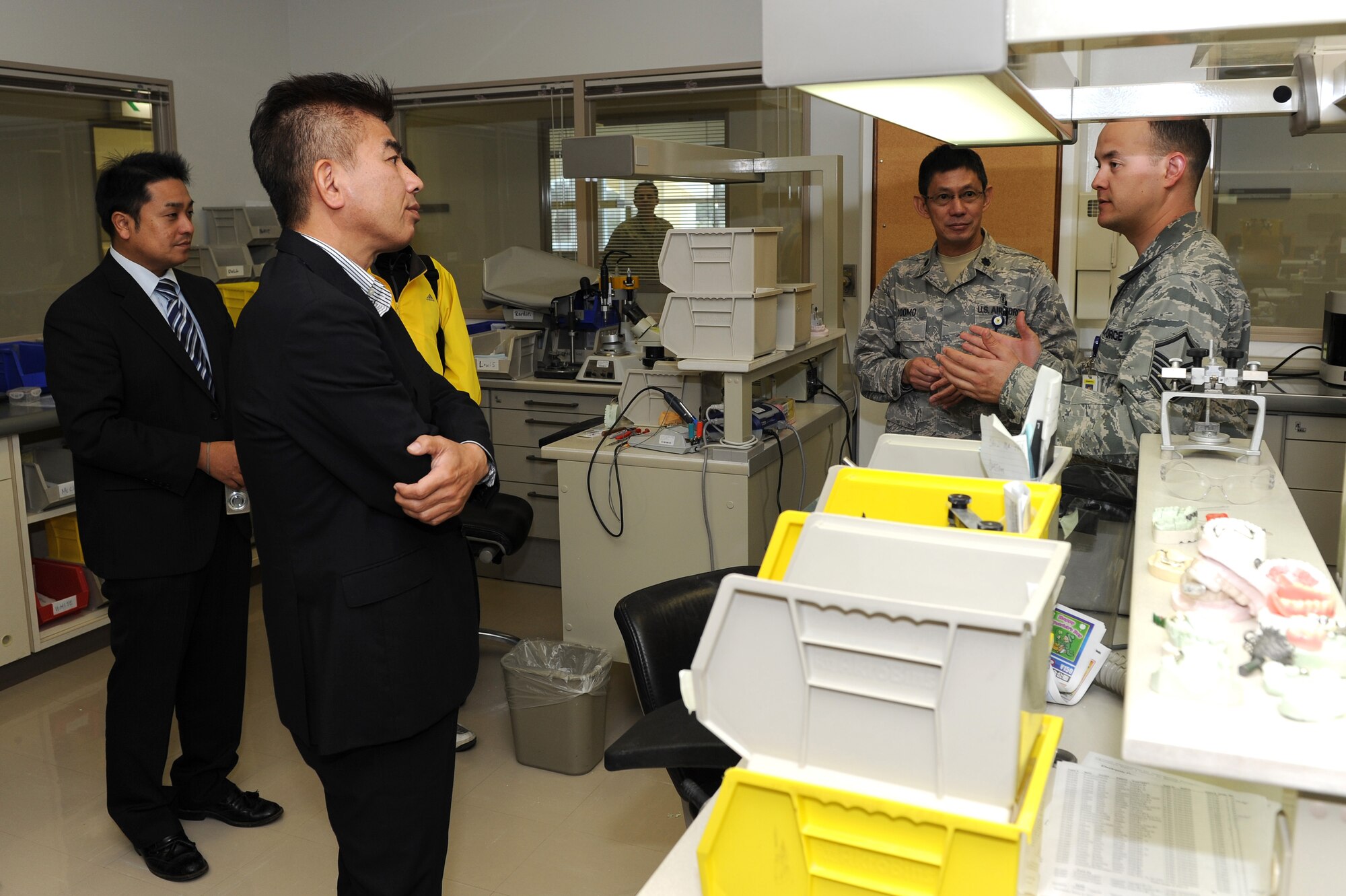 U.S. Air Force Master Sgt. Nicholaus Stopfer, 18th Dental Squadron’s Kadena Area Dental Laboratory non-commissioned officer in charge, gives a briefing at the Area Dental Laboratory to the Kadena Air Base's Okinawa Host Nation Dental Providers, Kadena Air Base, Japan, March 27. The 18th Dental Squadron hosted a half-day seminar with the invitation of the Kadena Air Base Okinawa Host Nation Dental Providers. The seminar kicked off with a mission brief greeting and a tour of the Dental Clinic facility. During the tour, host nation providers were able to exchange medical ideas and get information about the Kadena Dental Clinic system. (U.S. Air Force photo by Junko Kinjo/Released)
