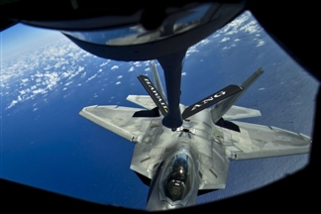 A Hawaii Air National Guard F-22 Raptor moves into position to take on fuel from a Stratotanker during a recent mission over the Pacific near the Hawaiian Islands on March 27, 2012.  Air Force Academy cadets on spring break were aboard the Stratotanker to observe the refueling procedure.  