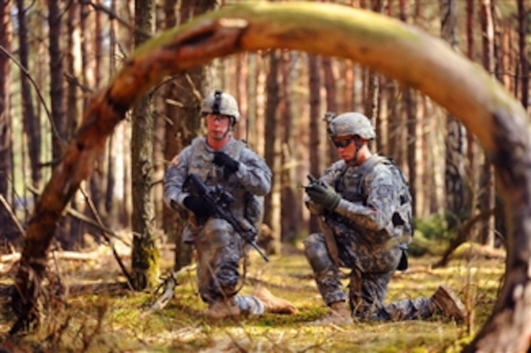 U.S. Army soldiers take a tactical pause while approaching their objective during a live fire exercise titled "Iron Anvil" at Grafenwoehr Training Area, Germany, on March 26, 2012.  The soldiers are assigned to I Company, 3rd Squadron, 2nd Cavalry Regiment.  