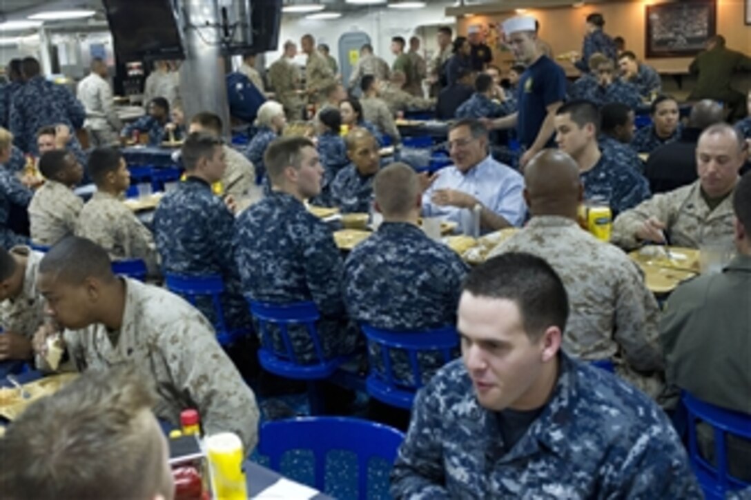 Secretary of Defense Leon E. Panetta has lunch with sailors and Marines on board the USS Peleliu (LHA 5) in the Pacific Ocean off the coast of San Diego, Calif., on March 30, 2012.  Panetta visited several areas on board the ship as well as viewing flight ops on deck.  