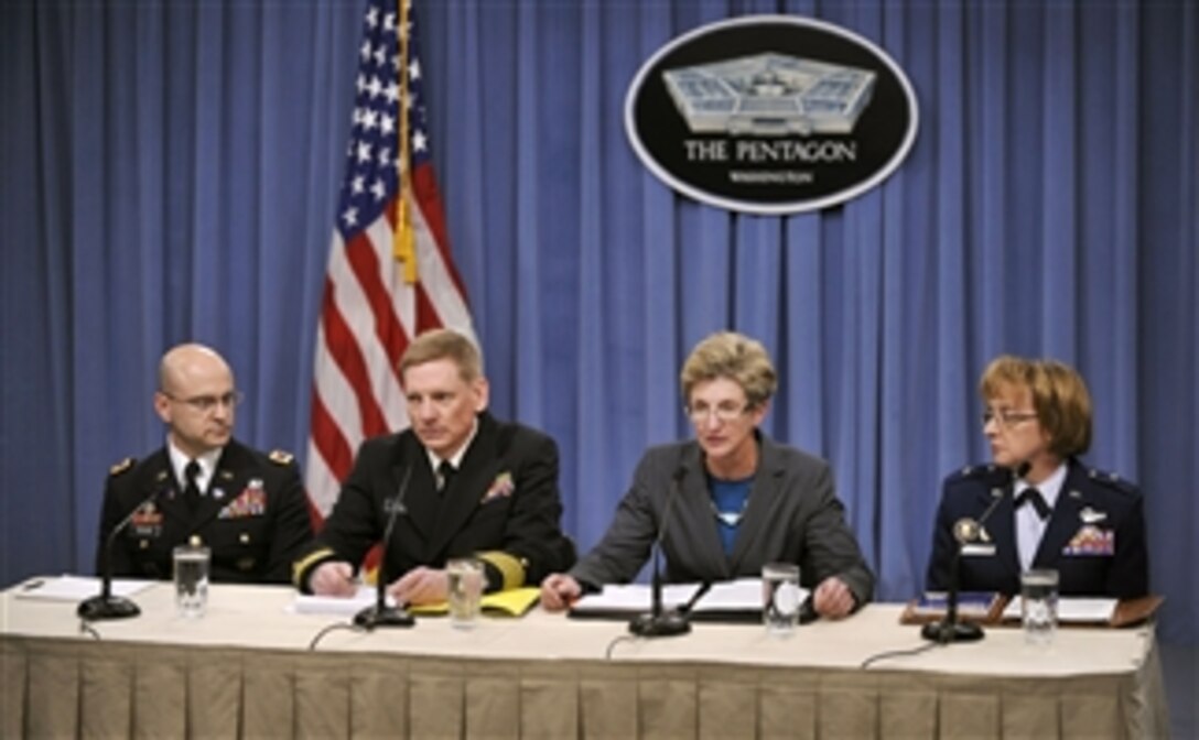Army Director, Casualty and Mortuary Affairs Col. Richard Teolis Jr. (left), Dover Medical Examiner Navy Capt. Craig Mallak, Acting Under Secretary of Defense for Personnel and Readiness Jo Ann Rooney (2nd from right) and Director of Air Force Services Brig. Gen. Eden J. Murrie brief the media about the release of the Appendix E documents for the Dover Port Mortuary Timeline.  