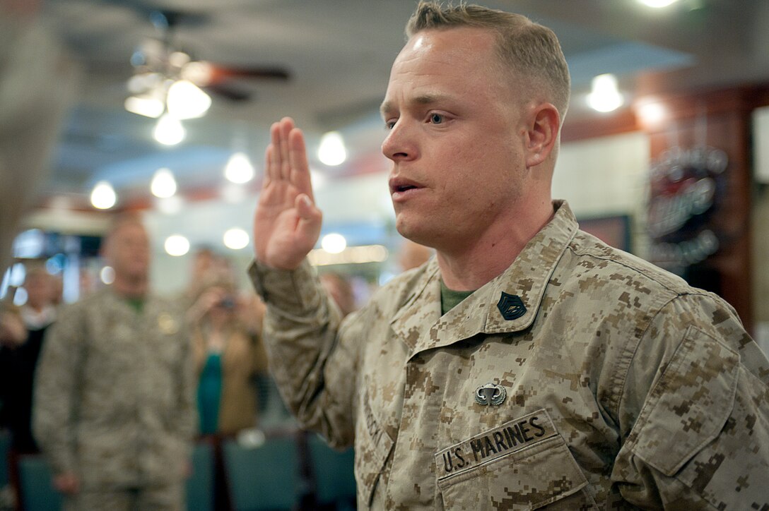 Gunnery Sgt. Corey Nawrocki, Guard Company's gunnery sergeant, takes the Oath of Enlistment during his meritorious promotion ceremony at Marine Barracks Washington April 2.