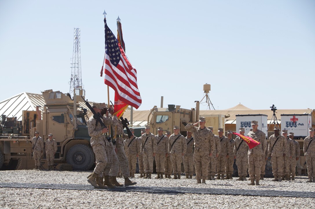 Marines and sailors with Marine Air-Ground Task Force Support Battalion 11.2, 1st Marine Logistics Group (Forward), salute the colors as they pass during a transfer of authority ceremony at Camp Leatherneck, Afghanistan, April 3. After a successful deployment providing logistics support to Regional Command Southwest, MSB 11.2 relinquished their responsibilities to 1st Maintenance Battalion (-) Reinforced, 1st MLG (Fwd).