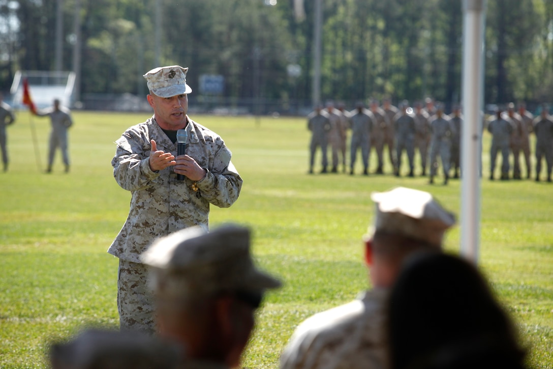 Col. Daniel J. Lecce, commanding officer of Marine Corps Base Camp Lejeune, speaks to service members, families and friends before stepping down as the base commander during the MCB Camp Lejeune and Marine Corps Installations - East re-designation ceremony, April 3.