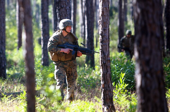 Lance Cpl. Joseph Snyder, a motor transport mechanic with Combat Logistics Regiment 25, 2nd Marine Logistics Group, patrols through a forest during a field exercise at Gun Position One aboard Camp Lejeune, N.C. April 3, 2012. The purpose of the field exercise was to get the regiment’s Marines and sailors out of their comfort zone and in the field to refresh and enhance basic battle skills they don’t get a chance to practice on a day-to-day basis. (U.S. Marine Corps photo by Pfc. Franklin E. Mercado)