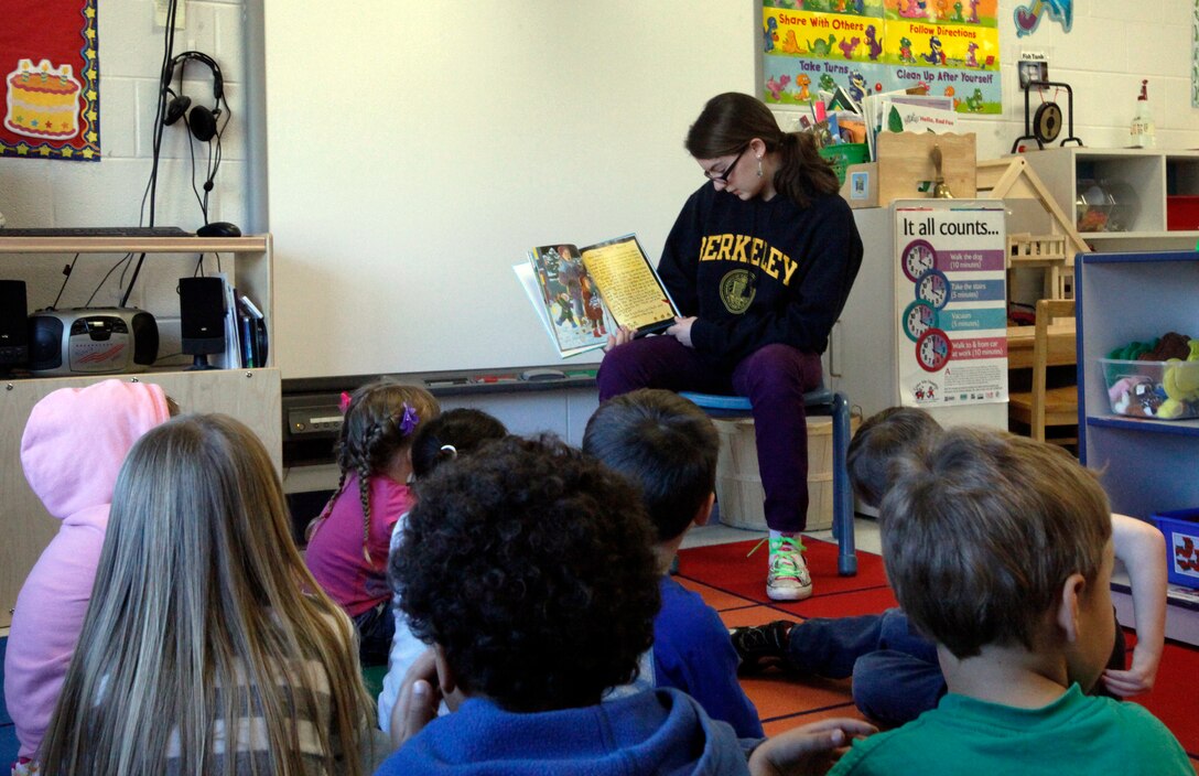 Lily M. Wade, 13, a Cherry Point military child, reads to a preschool class at the Child Development Center aboard Marine Corps Air Station Cherry Point, N.C., April 3, 2012. Lily volunteered through the Cherry Point Tween Center to spend time with the preschoolers during April’s Month of the Military Child.“Month of the Military Child” was formed in 1986 by former Defense Secretary Caspar Weinberger as an official Defense Department commemoration.