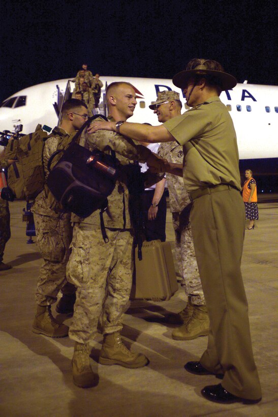 U.S. and Australia officials greet approximately 200 Marines and sailors from Hawaii as they arrive in Australia April 3. The Marines and sailors are with Company F, 2nd Battalion, 3rd Marine Regiment, 3rd Marine Division, III Marine Expeditionary Force.